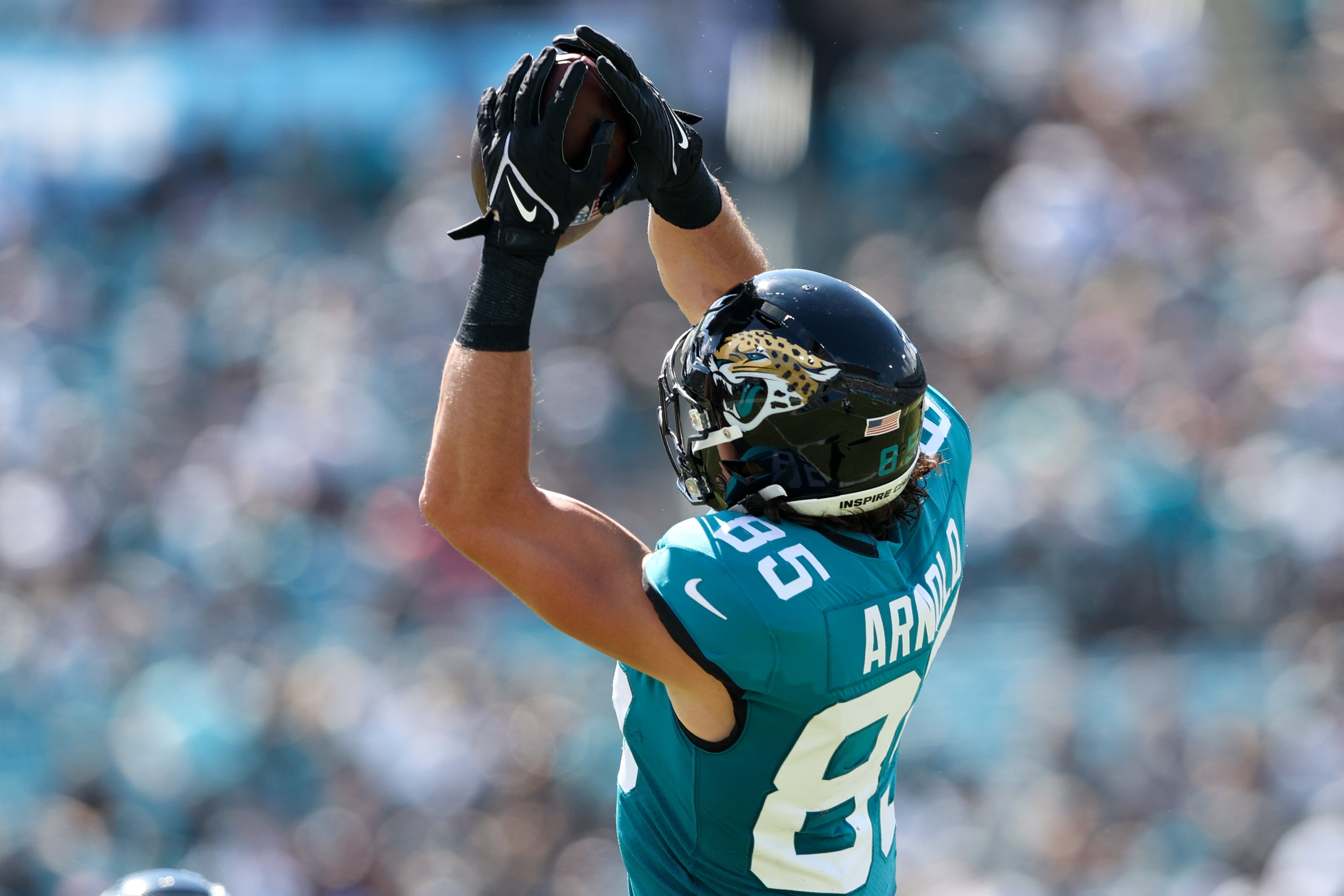 Oct 9, 2022; Jacksonville, Florida, USA; Jacksonville Jaguars tight end Dan Arnold (85) catches a pass against the Houston Texans in the second quarter at TIAA Bank Field. Mandatory Credit: