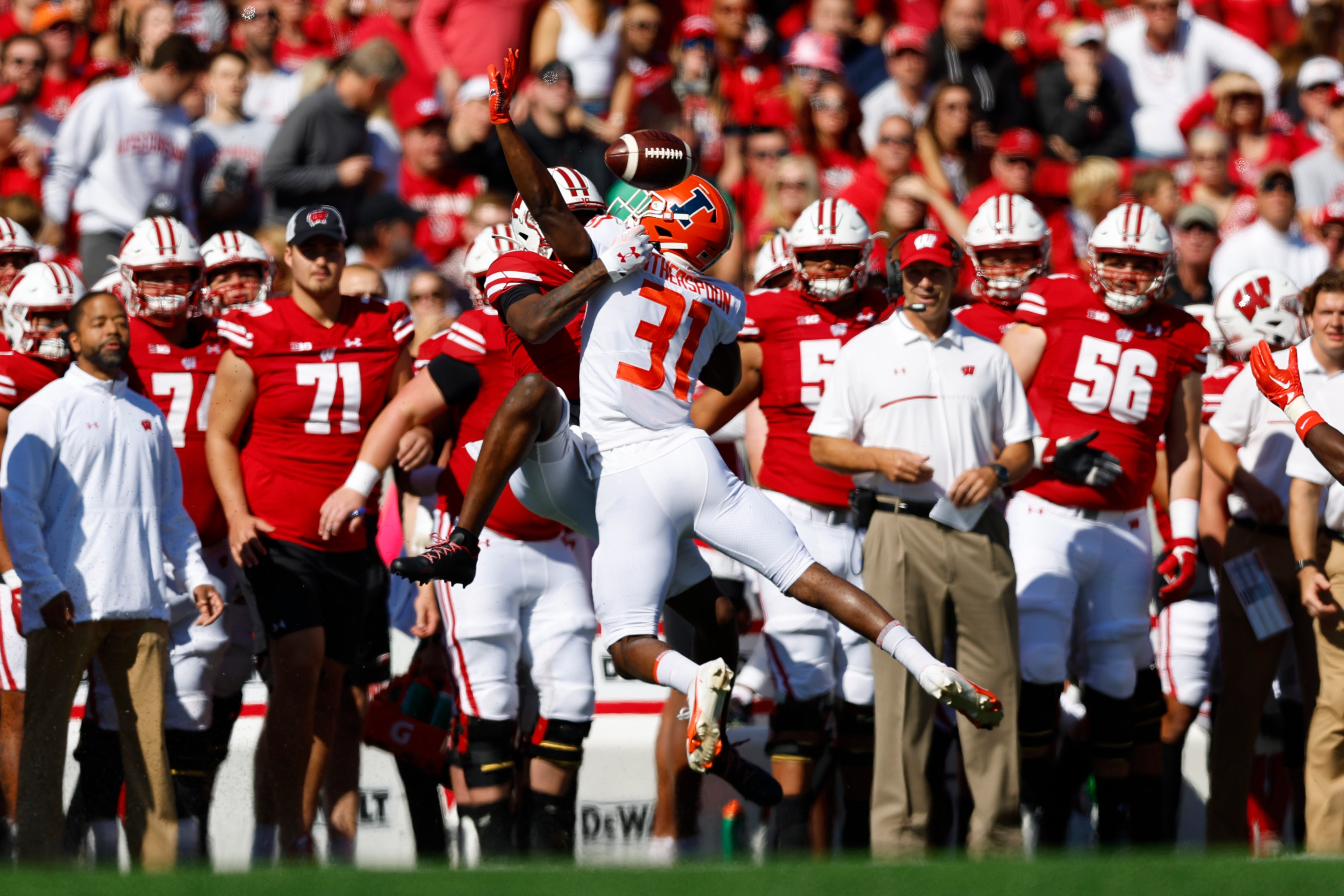 Oct 1, 2022; Madison, Wisconsin, USA; Illinois Fighting Illini defensive back Devon Witherspoon (31) breaks up the pass during the first quarter against the Wisconsin Badgers at Camp Randall Stadium.