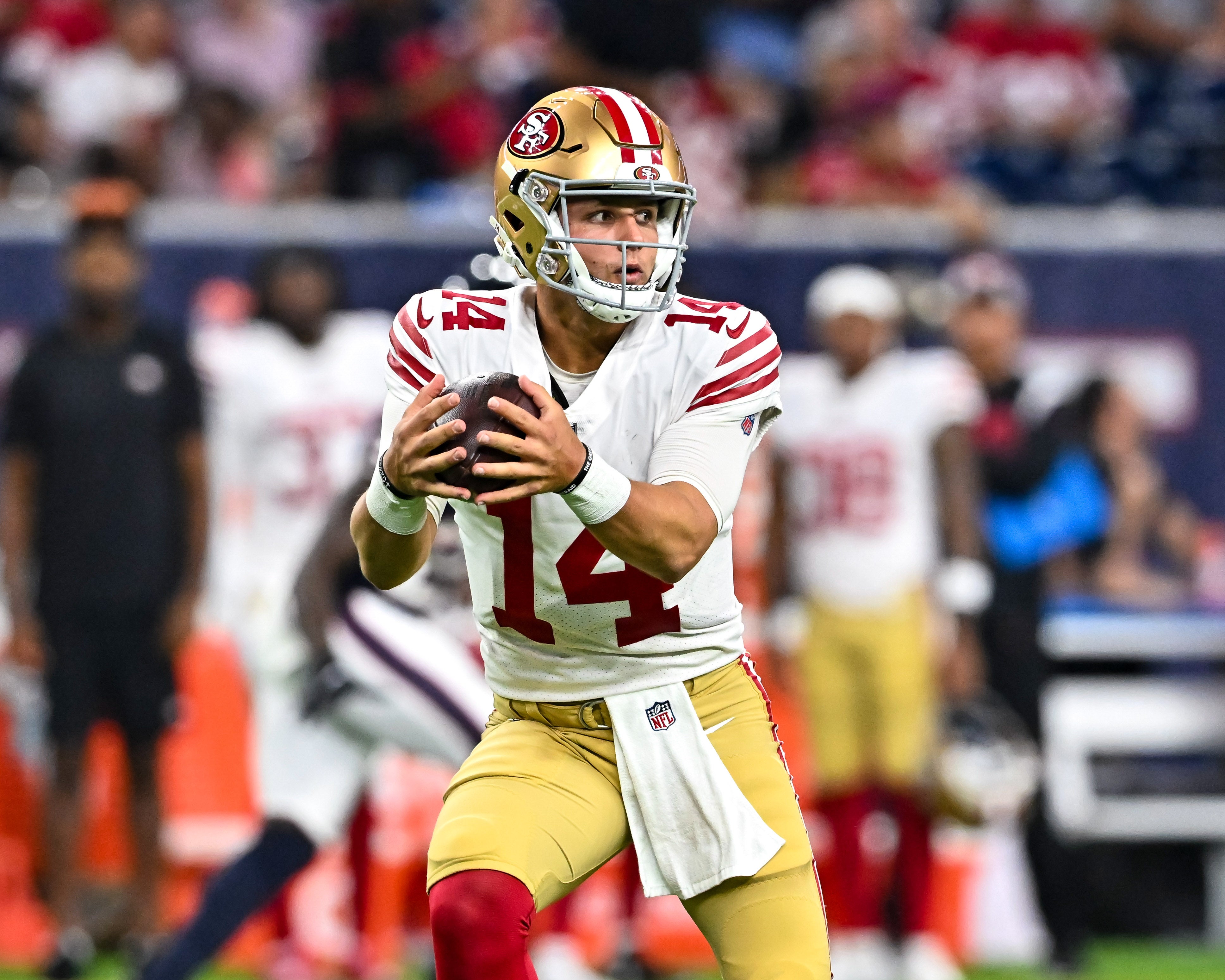 Aug 25, 2022; Houston, Texas, USA; San Francisco 49ers quarterback Brock Purdy (14) recovers a fumbled snap during the second half against the Houston Texans at NRG Stadium.