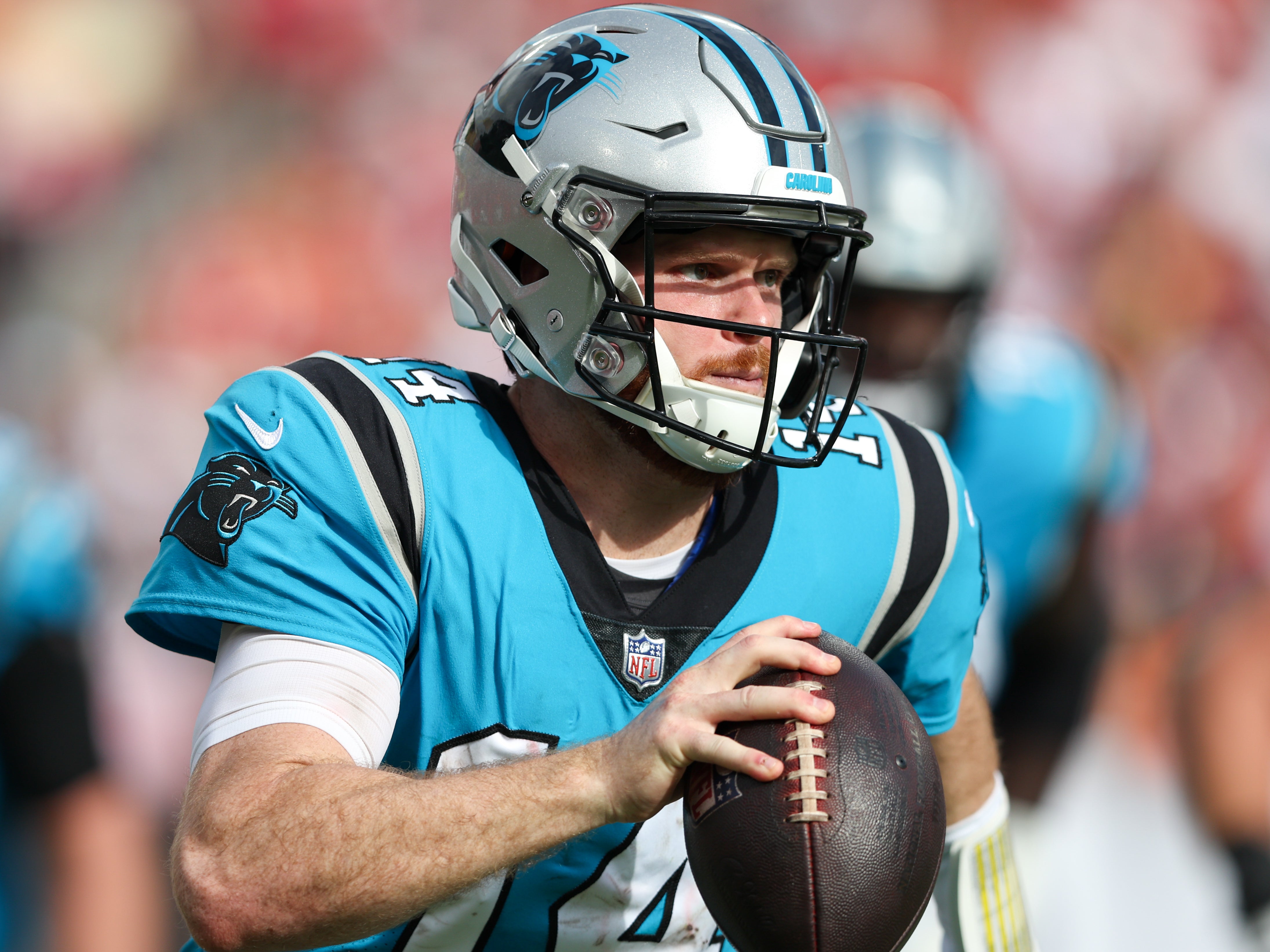 Jan 1, 2023; Tampa, Florida, USA; Carolina Panthers quarterback Sam Darnold (14) looks to pass against the Tampa Bay Buccaneers in the third quarter at Raymond James Stadium.