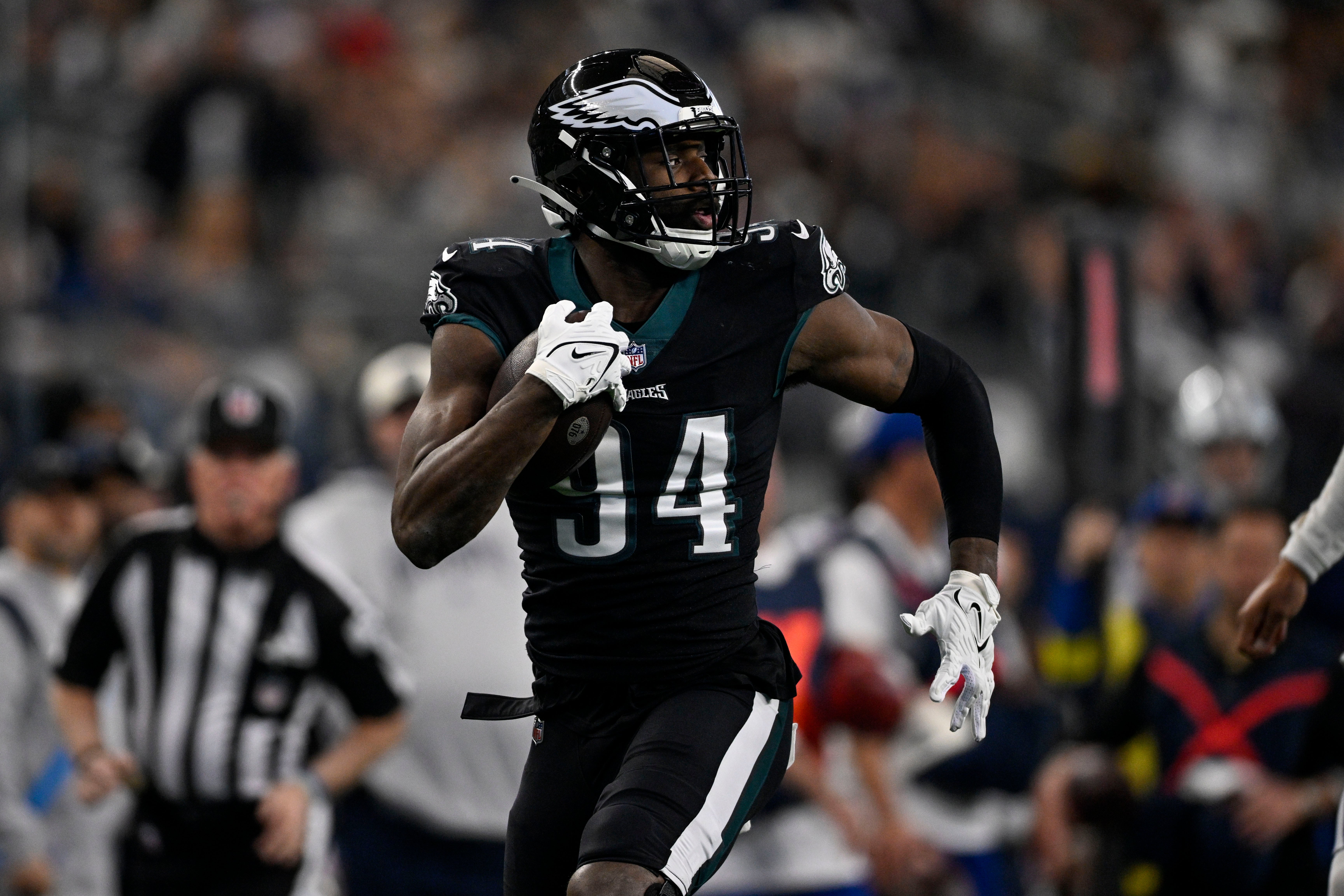 Dec 24, 2022; Arlington, Texas, USA; Philadelphia Eagles defensive end Josh Sweat (94) scores a touchdown on interception against Dallas Cowboys quarterback Dak Prescott (not pictured) during the first quarter at AT&T Stadium. Mandatory Credit: Jerome Miron-USA TODAY Sports