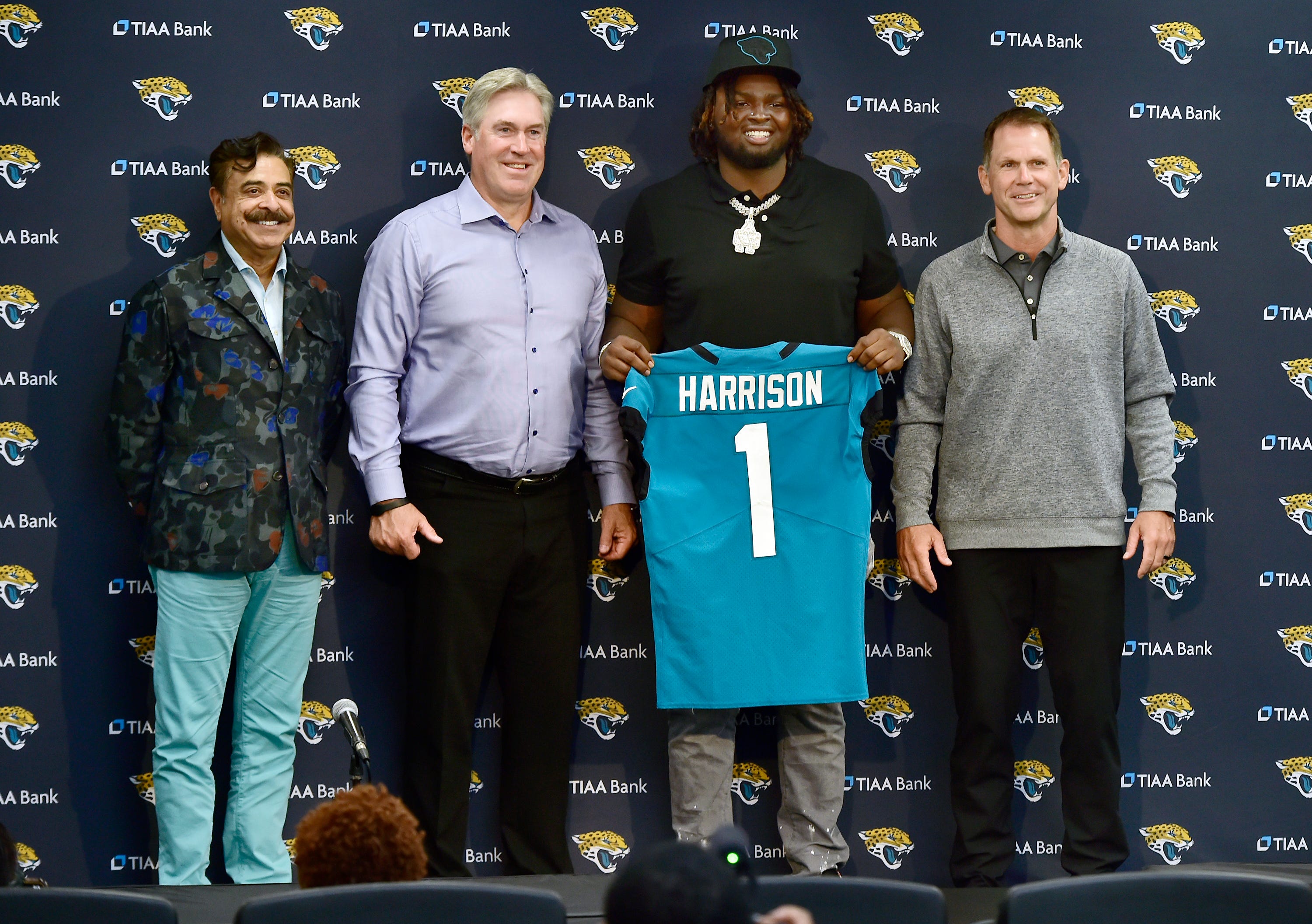 Jacksonville Jaguars first-round pick Anton Harrison surrounded by Doug Pederson, Trent Baalke, and Shahid Khan.