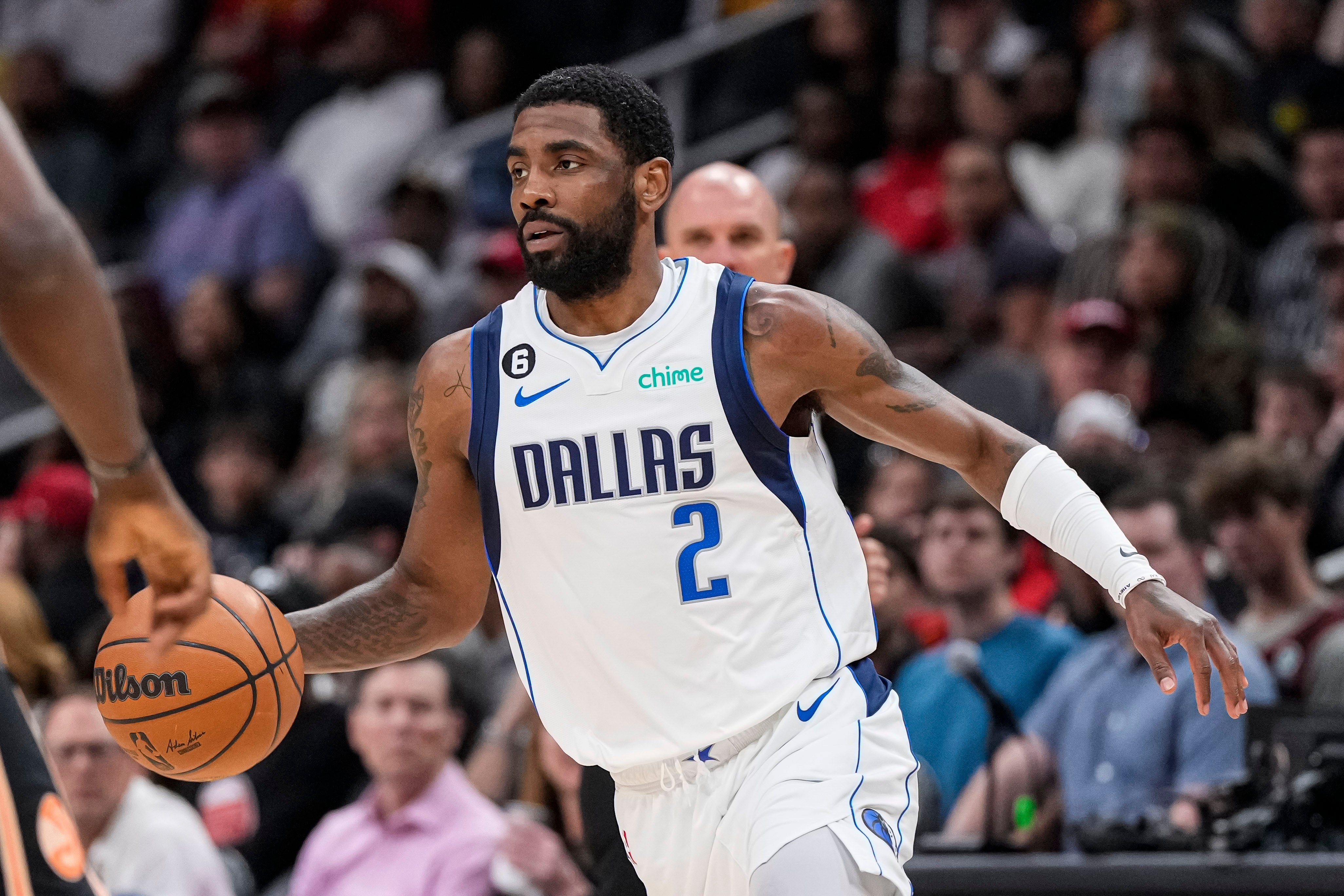 Apr 2, 2023; Atlanta, Georgia, USA; Dallas Mavericks guard Kyrie Irving (2) dribbles against the Atlanta Hawks during the first half at State Farm Arena.