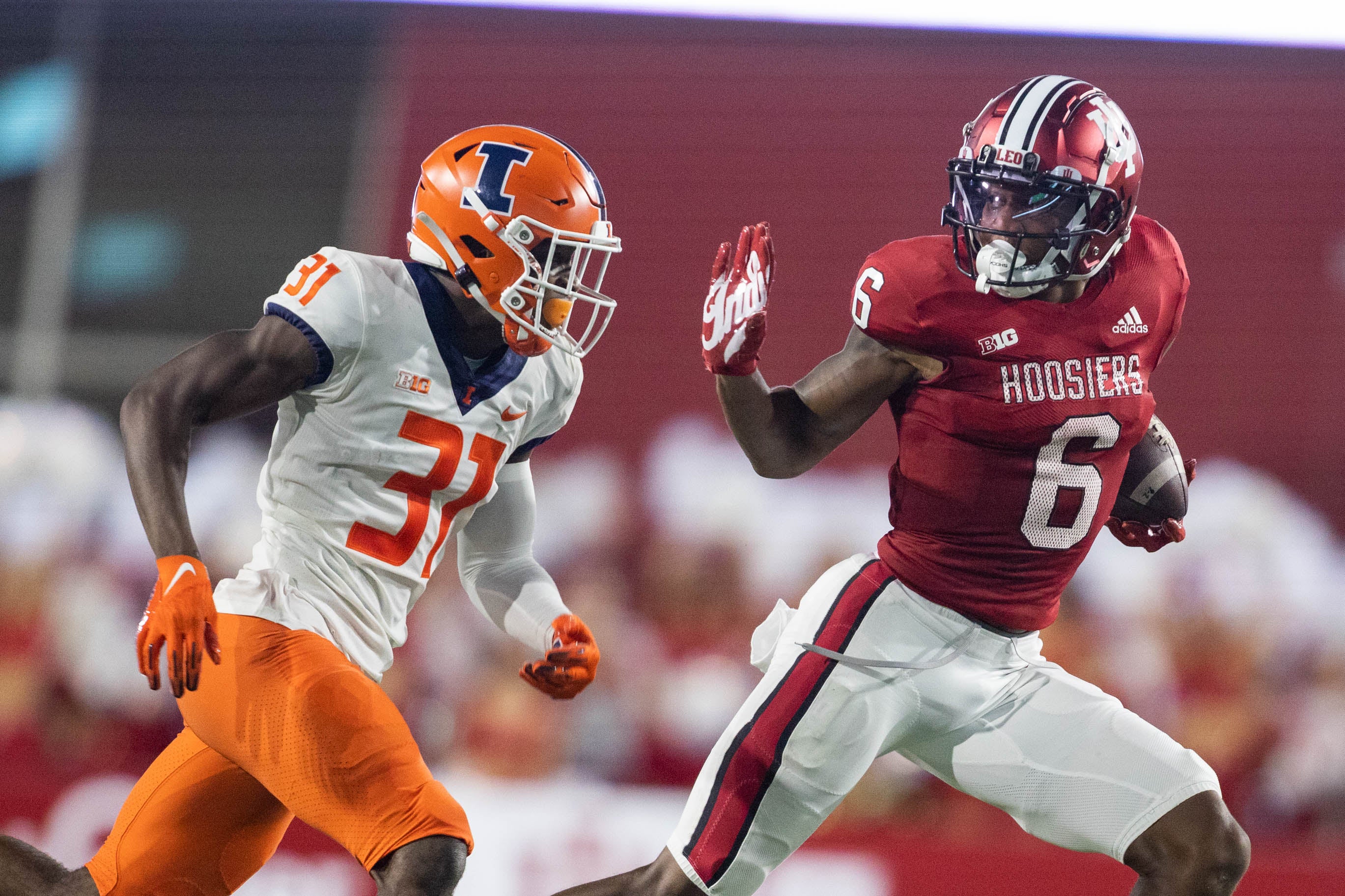 Sep 2, 2022; Bloomington, Indiana, USA; Indiana Hoosiers wide receiver Cam Camper (6) runs with the ball after a catch while Illinois Fighting Illini defensive back Devon Witherspoon (31) defends in the second quarter at Memorial Stadium.