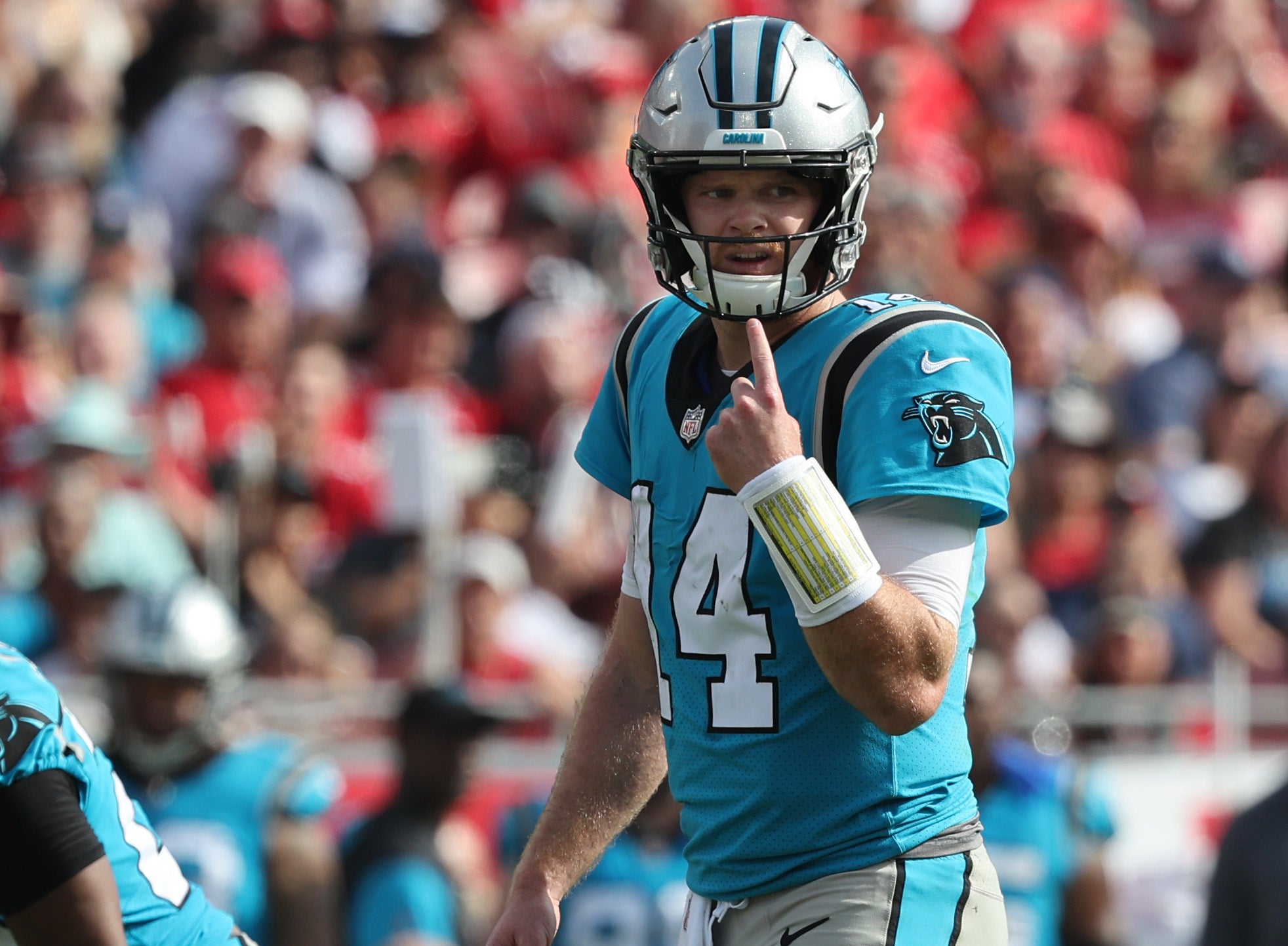 Jan 1, 2023; Tampa, Florida, USA; Carolina Panthers quarterback Sam Darnold (14) calls a play against the Tampa Bay Buccaneers during the first half at Raymond James Stadium.