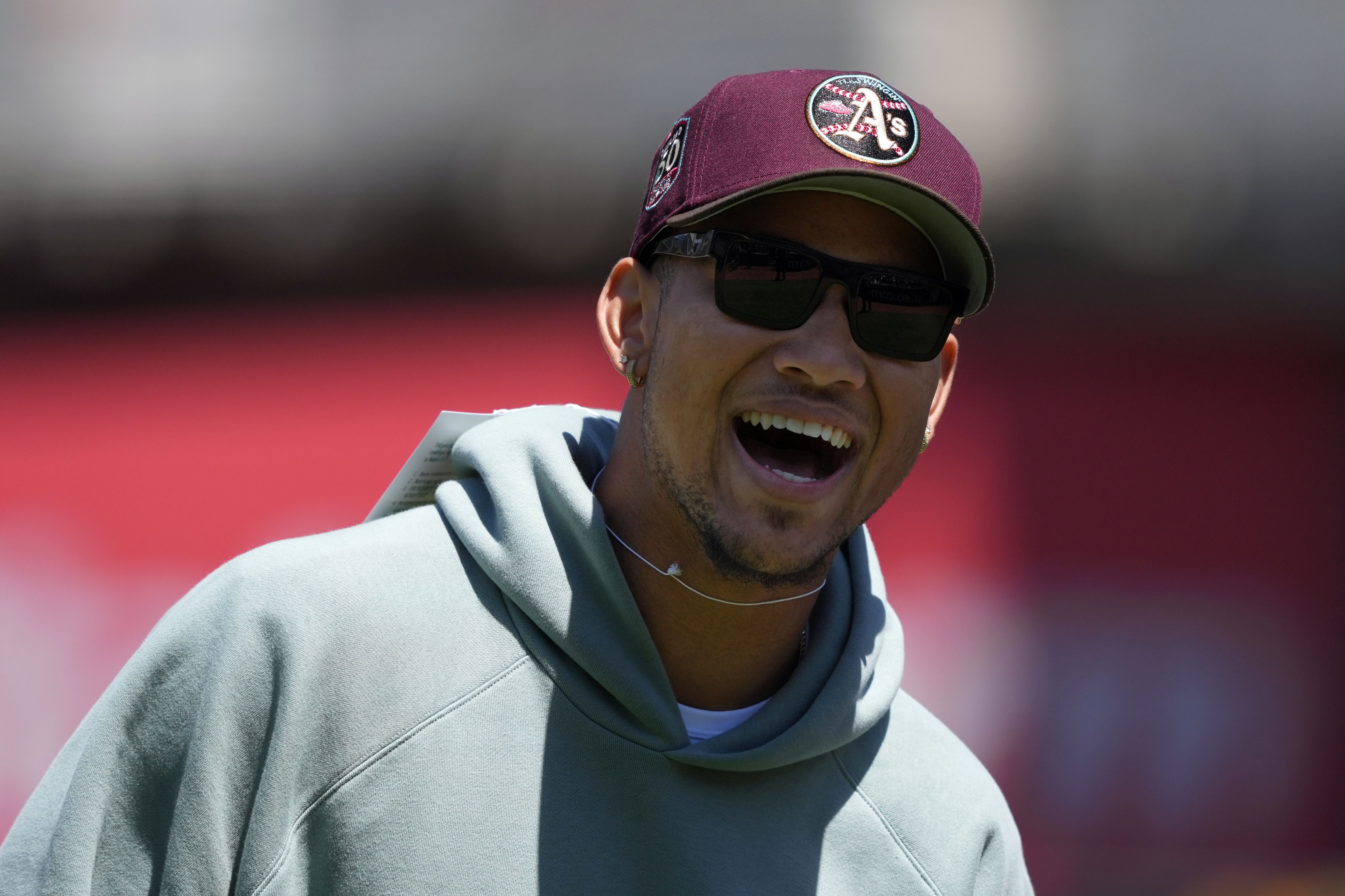 May 14, 2023; Oakland, California, USA; San Francisco 49ers quarterback Trey Lance stands on the field before the game between the Oakland Athletics and the Texas Rangers at Oakland-Alameda County Coliseum.