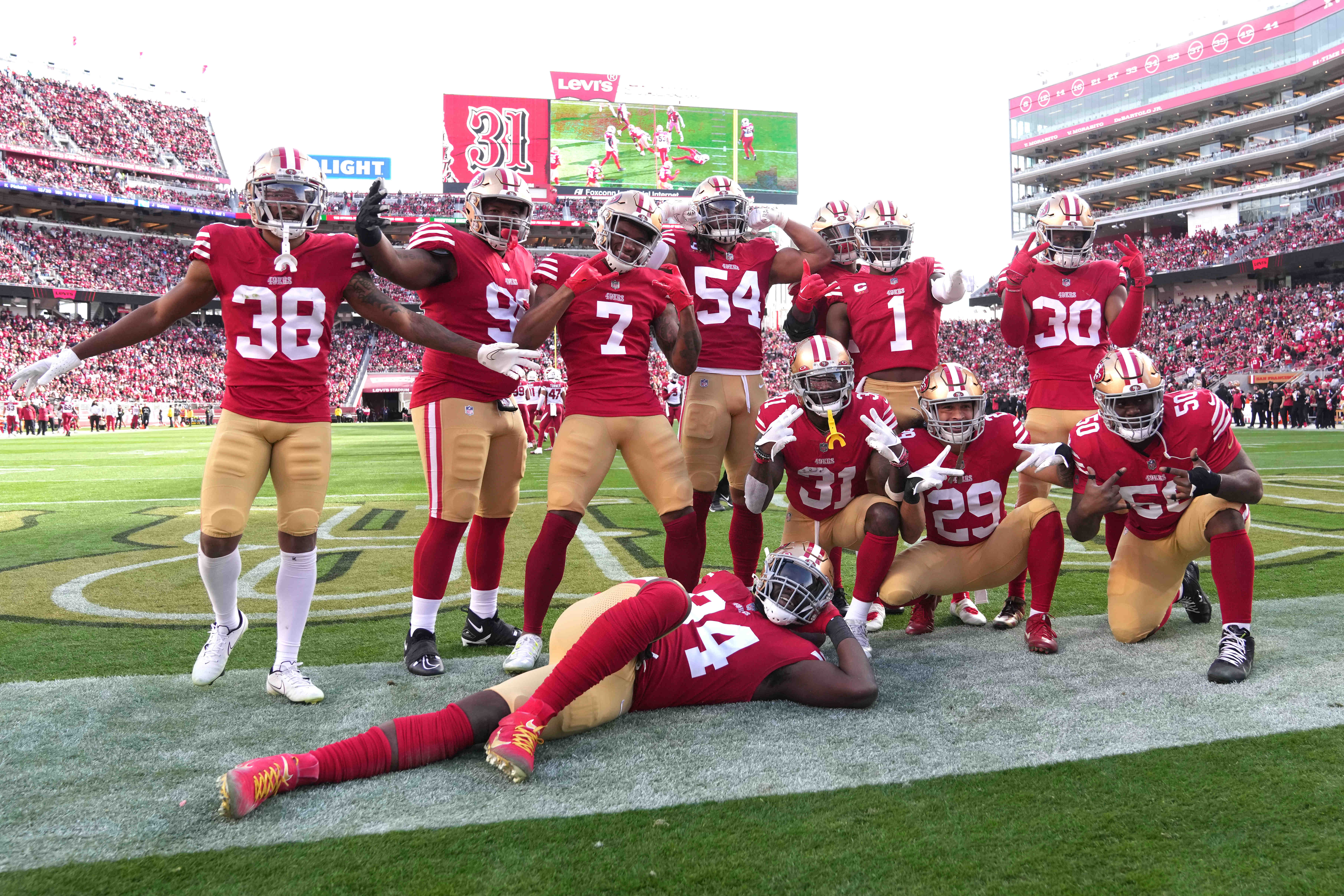 Jan 8, 2023; Santa Clara, California, USA; San Francisco 49ers defensive players pose for a photo after an interception by safety Tashaun Gipson Sr. (31) during the second quarter against the Arizona Cardinals at Levi's Stadium.