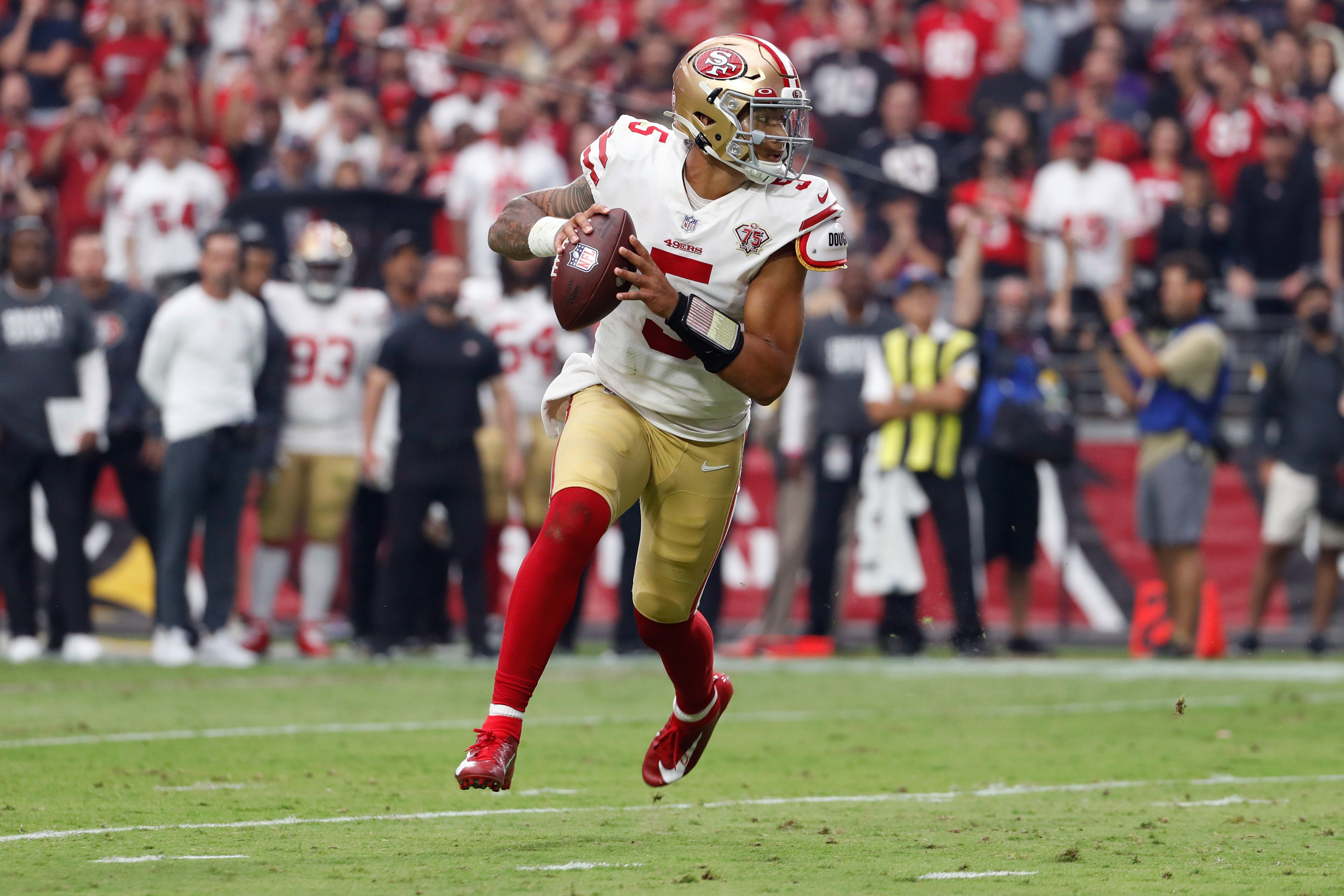 Oct 10, 2021; Glendale, Arizona, USA; San Francisco 49ers quarterback Trey Lance (5) runs during the first half against the Arizona Cardinals at State Farm Stadium.