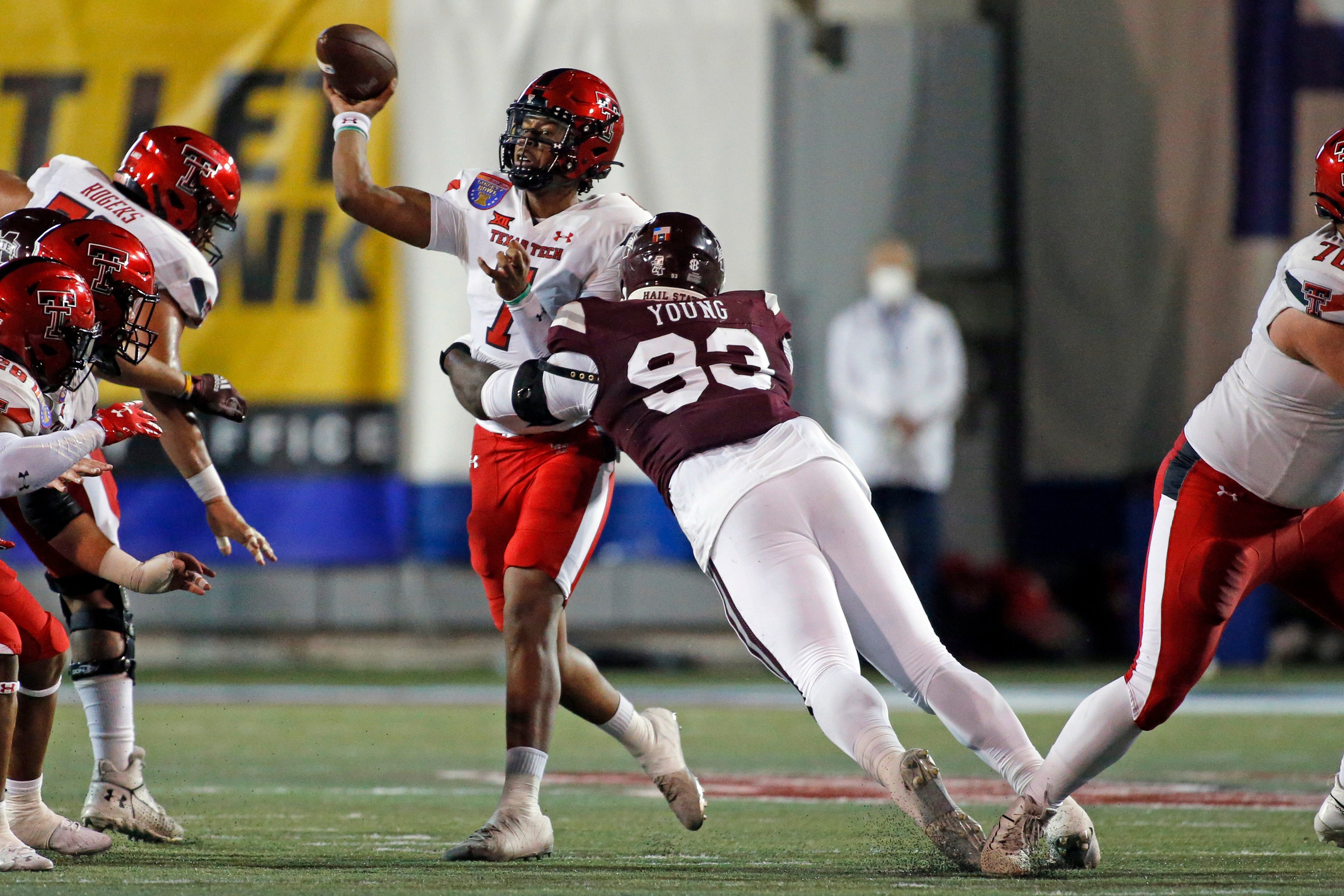 Dec 28, 2021; Memphis, TN, USA; Texas Tech Red Raiders quarterback Donovan Smith (7) passes the ball as Mississippi State Bulldogs defensive linemen Cameron Young (93) rushes the pass during the first half at Liberty Bowl Stadium.