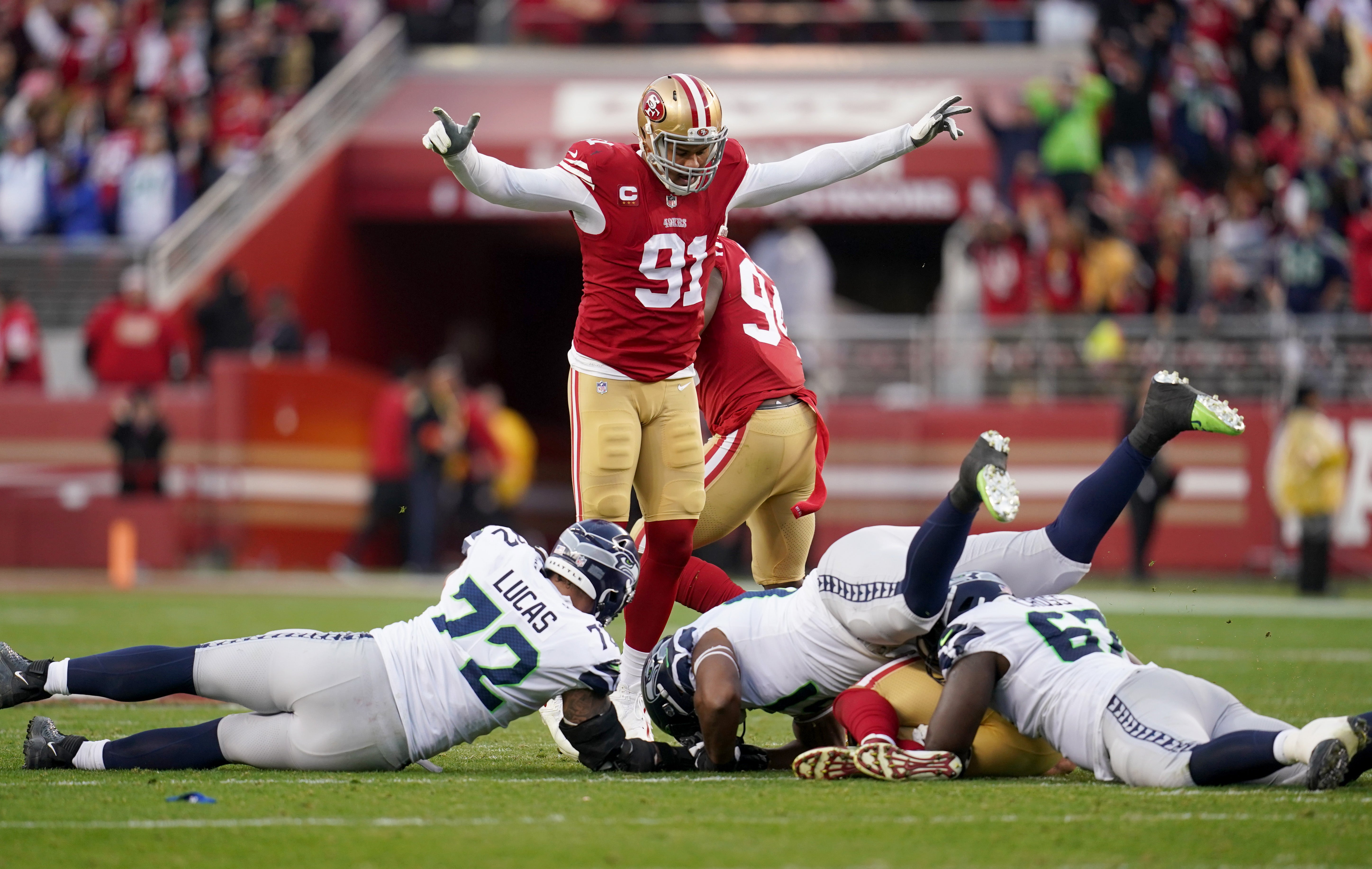 Jan 14, 2023; Santa Clara, California, USA; San Francisco 49ers defensive end Arik Armstead (91) gestures after Nick Bosa (97, not shown) recovered a fumble in the third quarter of a wild card game against the Seattle Seahawks at Levi's Stadium. Mandatory Credit: Cary Edmondson-USA TODAY Sports