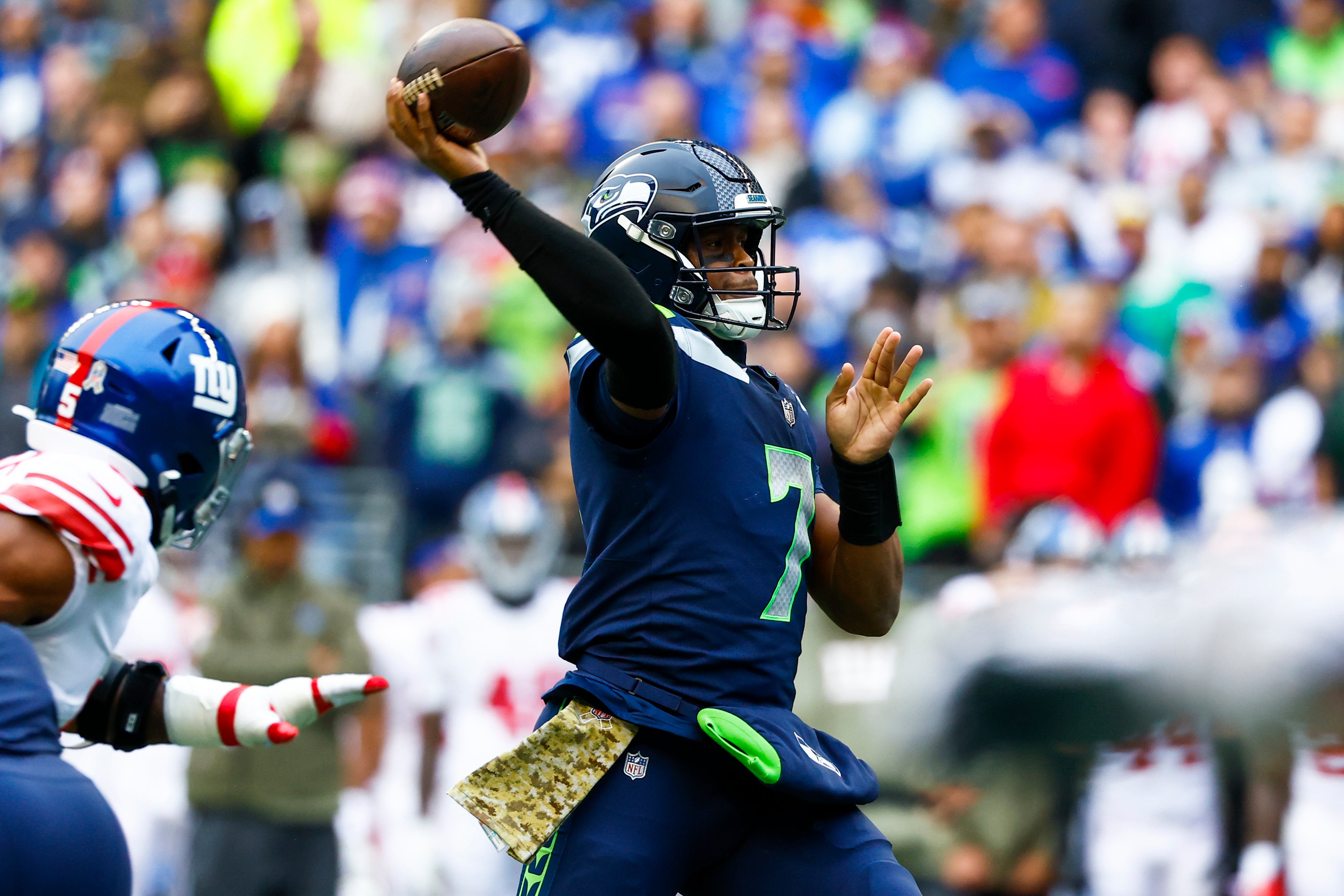 Oct 30, 2022; Seattle, Washington, USA; Seattle Seahawks quarterback Geno Smith (7) passes for a touchdown against the New York Giants during the second quarter at Lumen Field.