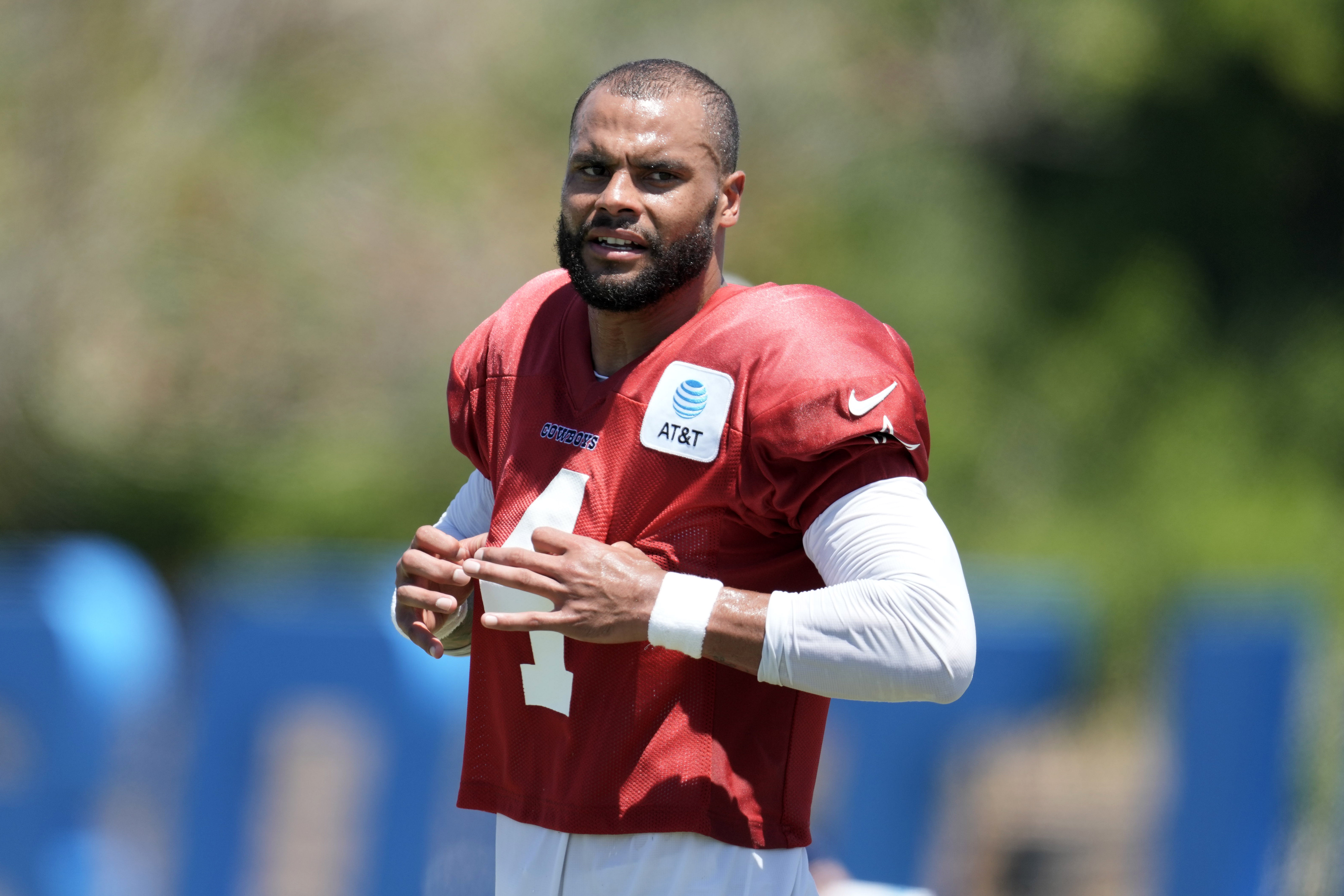 Dallas Cowboys QB Dak Prescott wearing a red jersey in practice