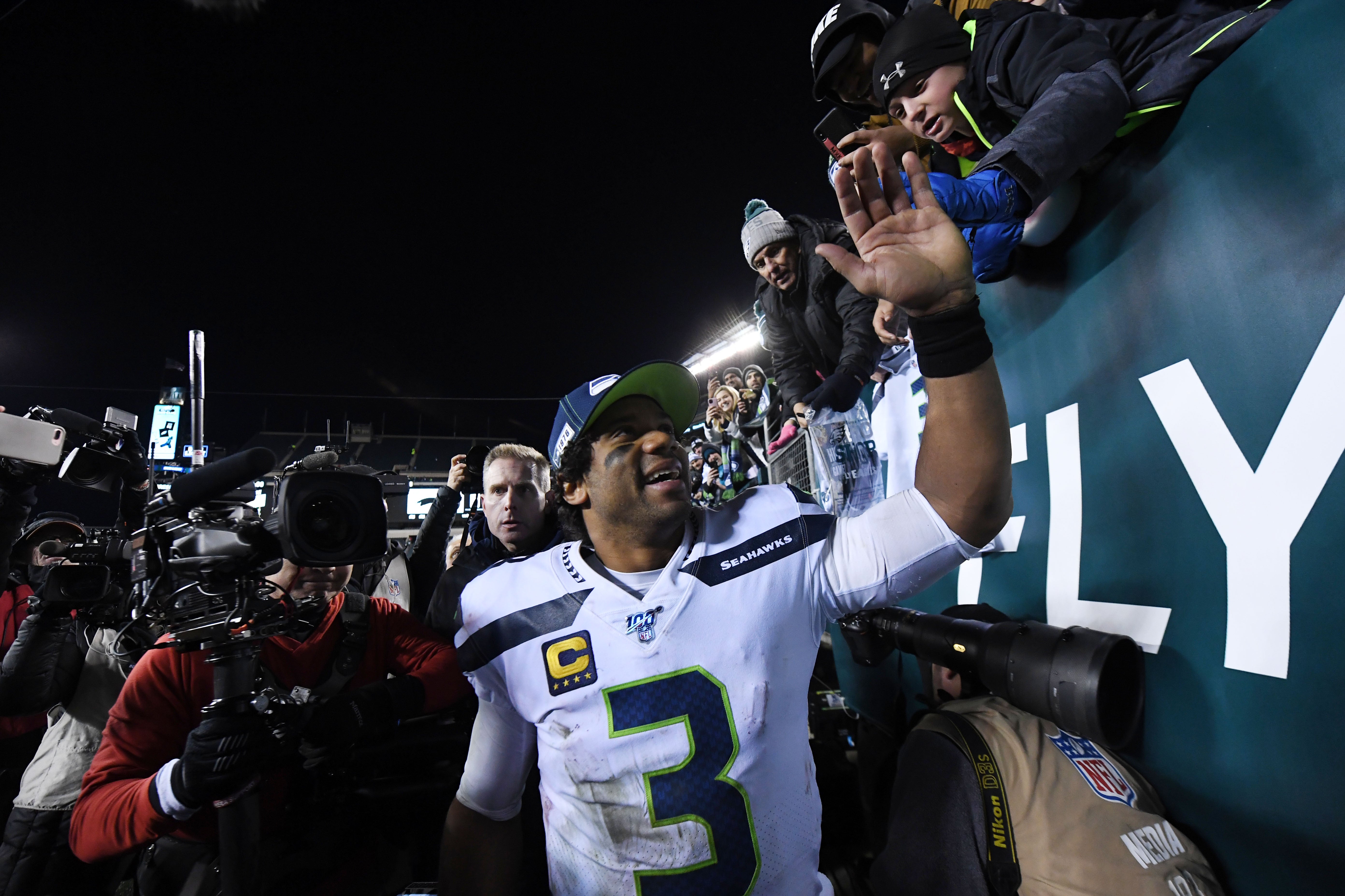 Jan 5, 2020; Philadelphia, Pennsylvania, USA; Seattle Seahawks quarterback Russell Wilson (3) celebrates after defeating the Philadelphia Eagles in a NFC Wild Card playoff football game at Lincoln Financial Field.