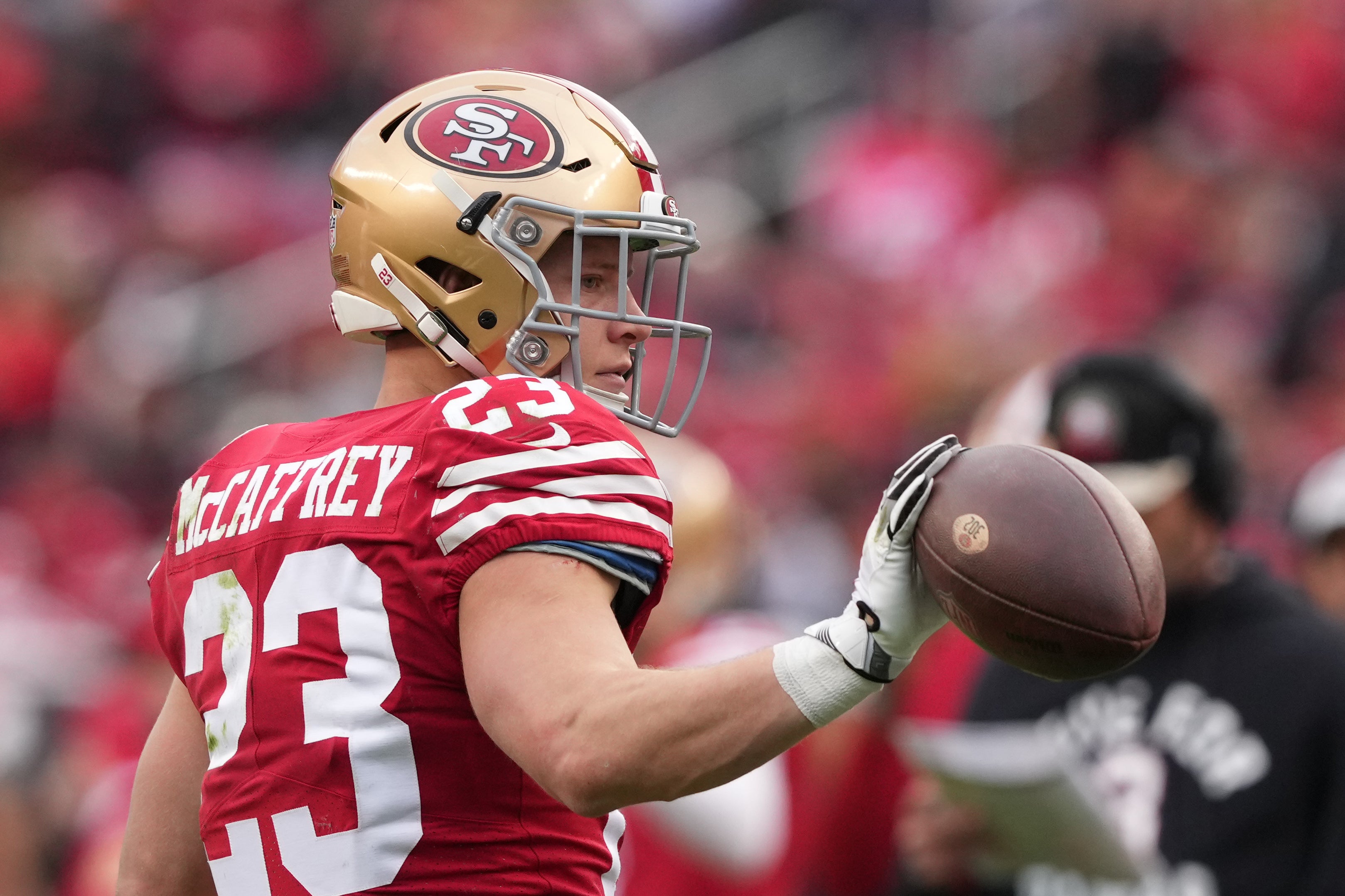 Jan 8, 2023; Santa Clara, California, USA; San Francisco 49ers running back Christian McCaffrey (23) tosses the ball after a catch against the Arizona Cardinals during the second quarter at Levi's Stadium.