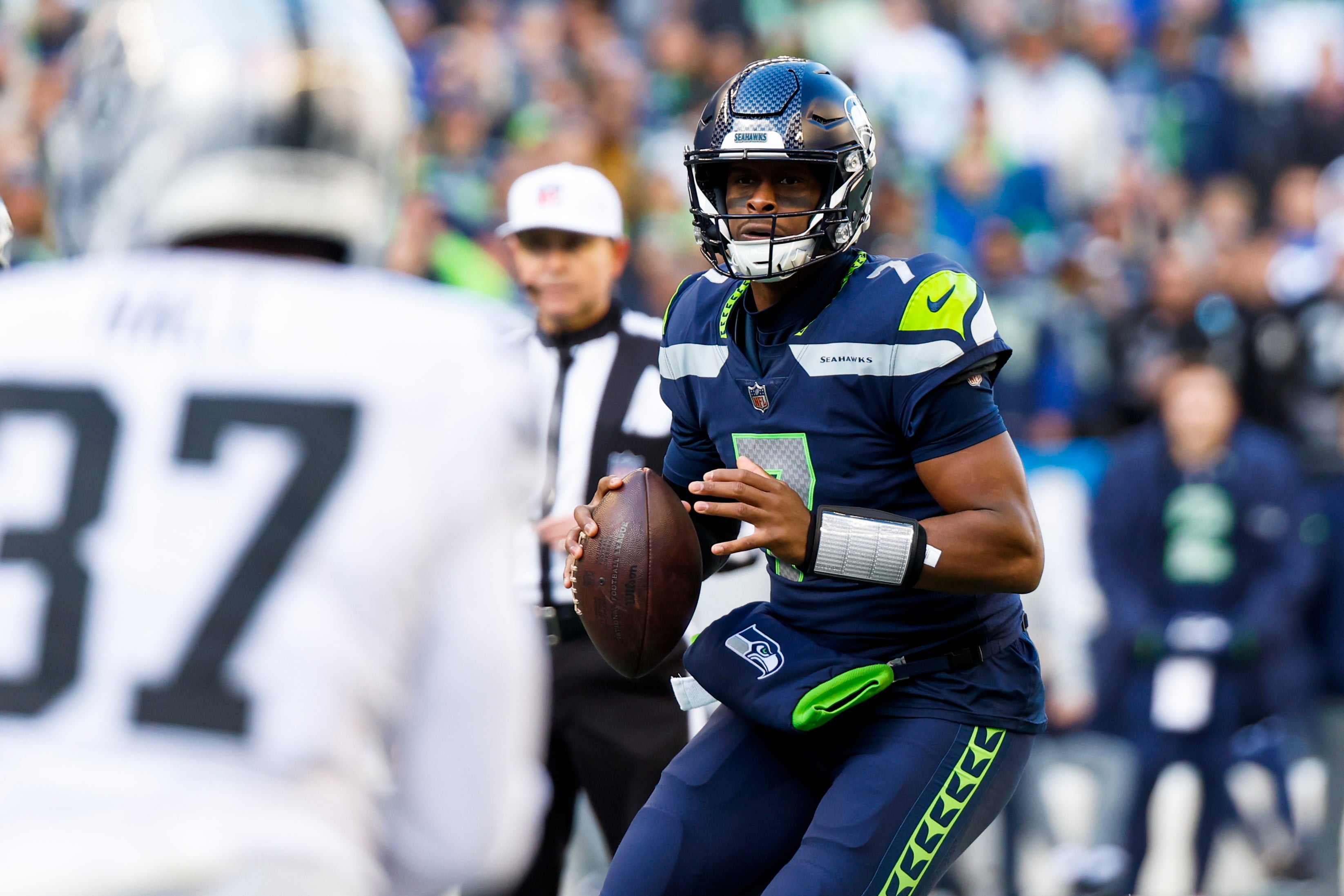 Nov 27, 2022; Seattle, Washington, USA; Seattle Seahawks quarterback Geno Smith (7) looks to pass against the Las Vegas Raiders during the first quarter at Lumen Field.