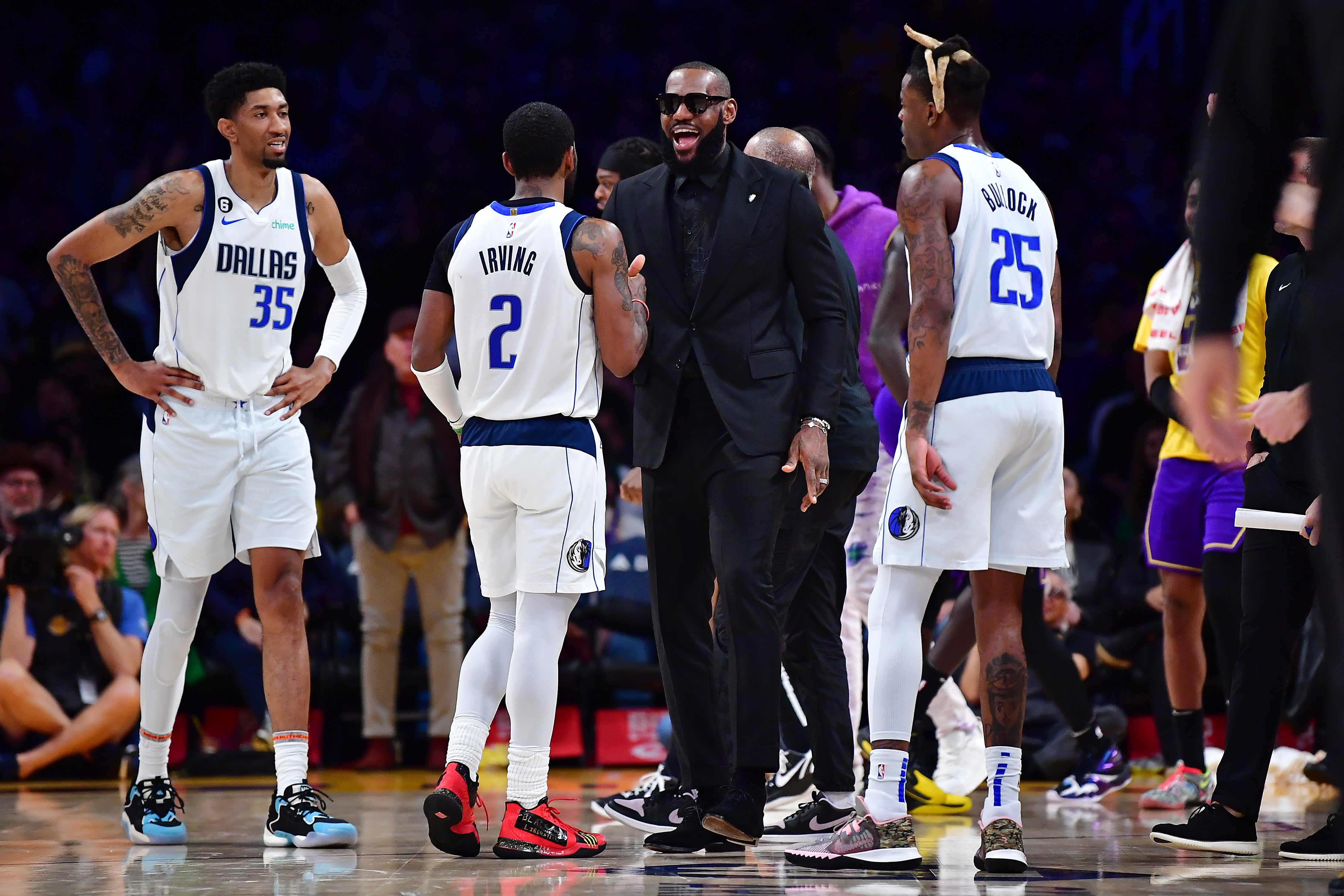 Mar 17, 2023; Los Angeles, California, USA; Los Angeles Lakers forward LeBron James (6) meets with Dallas Mavericks guard Kyrie Irving (2) during a time out in the second half at Crypto.com Arena.