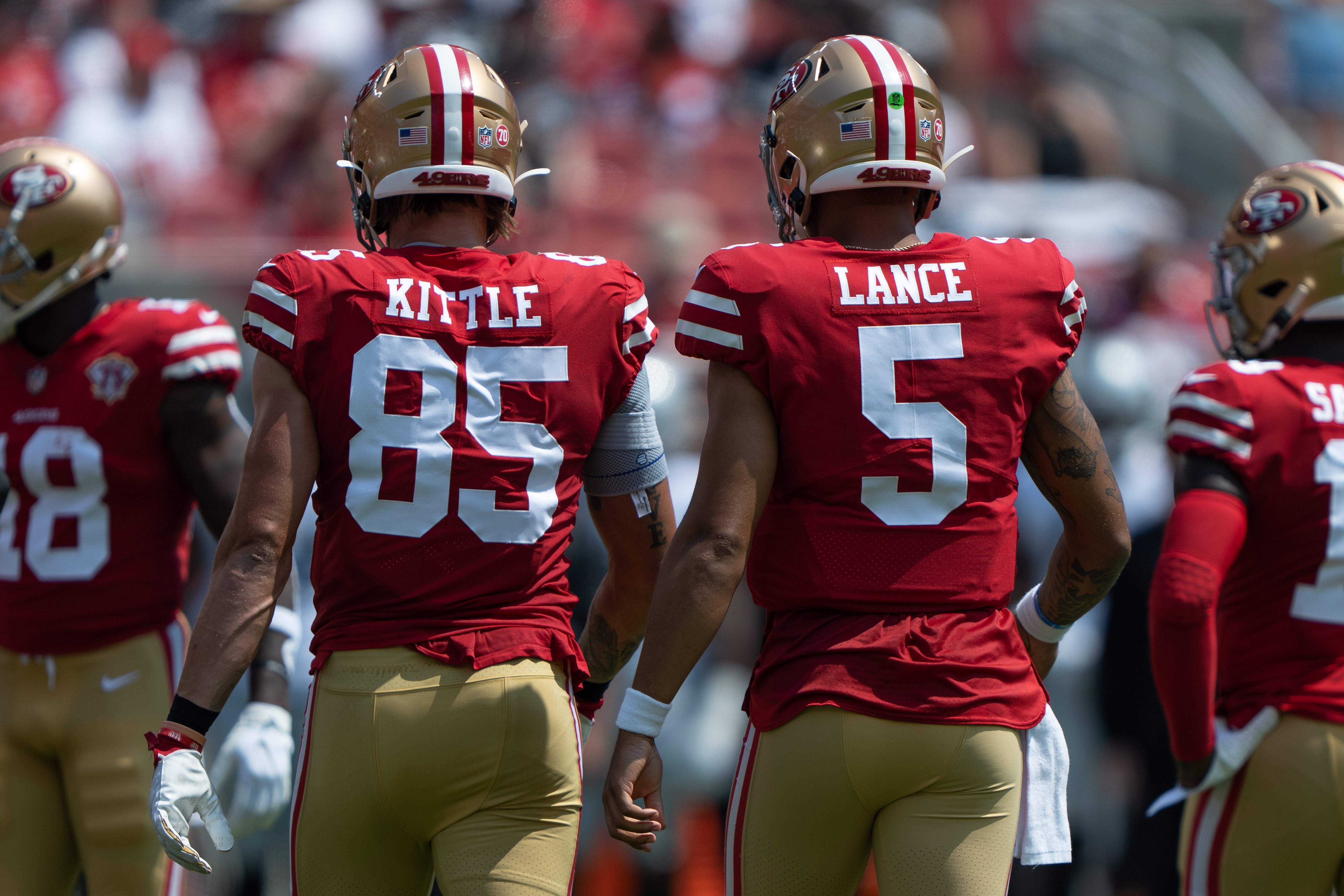 Aug 29, 2021; Santa Clara, California, USA; San Francisco 49ers tight end George Kittle (85) and quarterback Trey Lance (5) during the first quarter against the Las Vegas Raiders at Levi's Stadium.