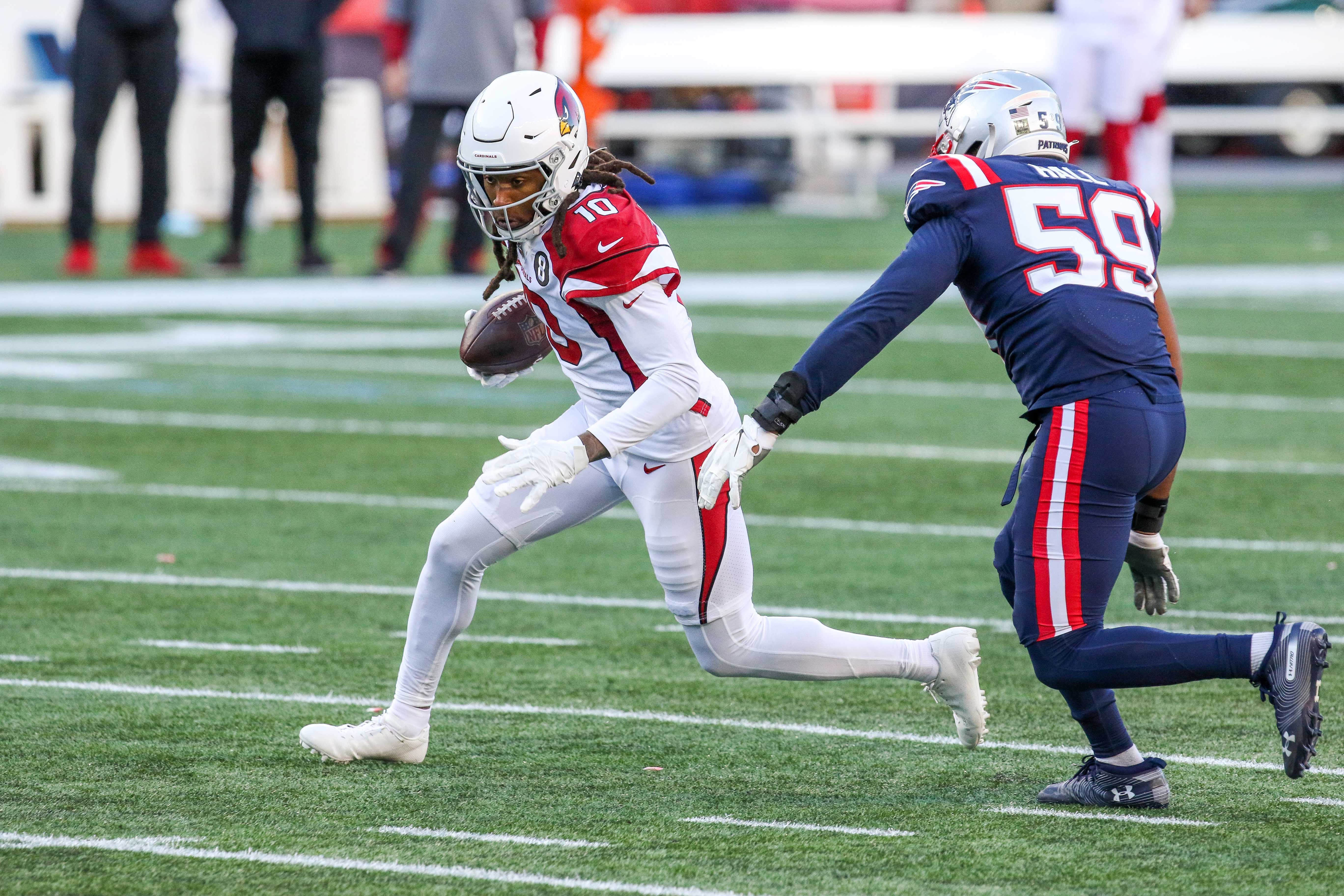 Wide receiver DeAndre Hopkins running after catching a pass at Gillette Stadium.