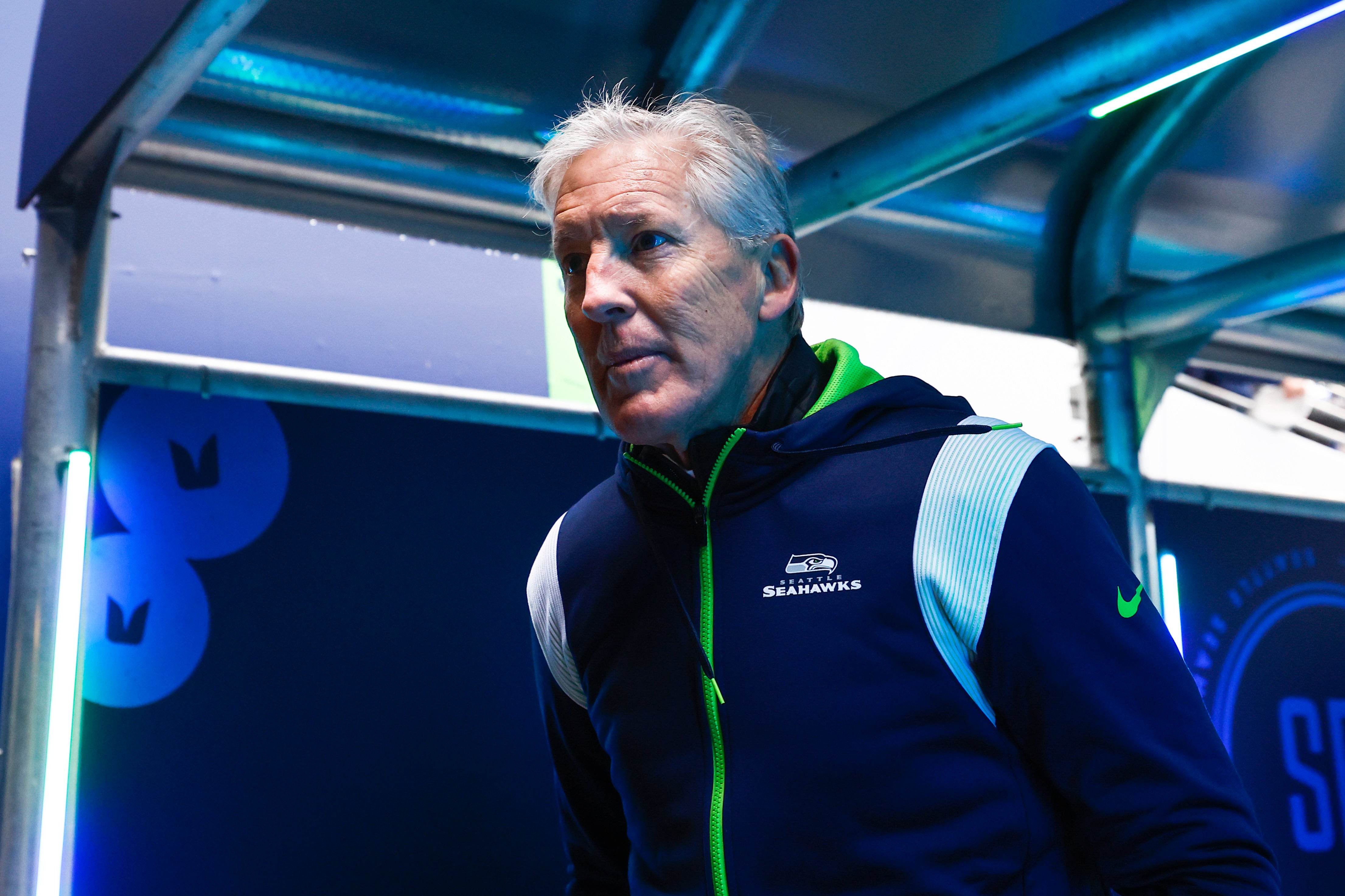 Jan 1, 2023; Seattle, Washington, USA; Seattle Seahawks head coach Pete Carroll returns to the locker room during pregame warmups against the New York Jets at Lumen Field.