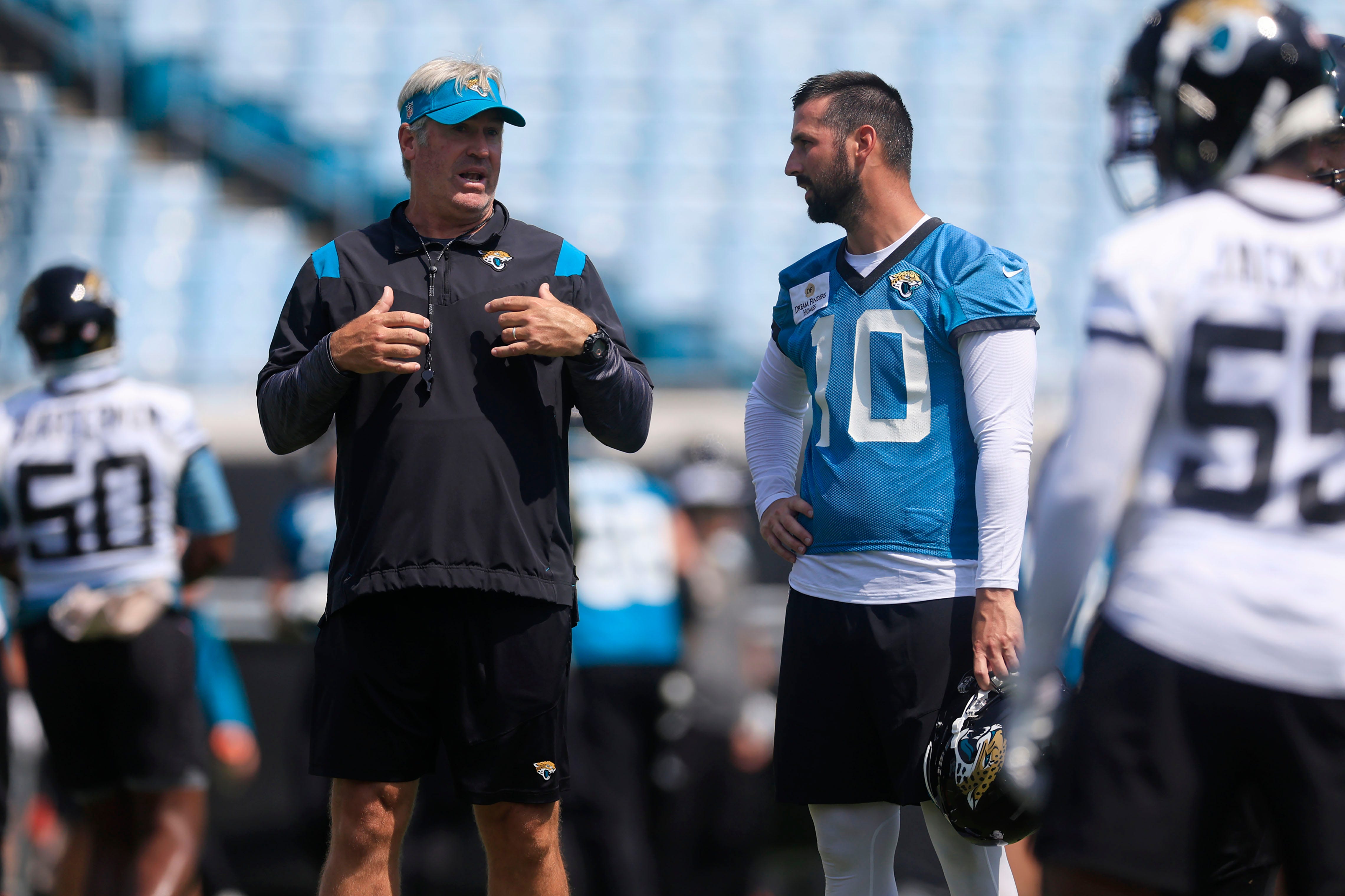 Jacksonville Jaguars HC Doug Pederson talking to K Brandon McManus in OTAs practice.