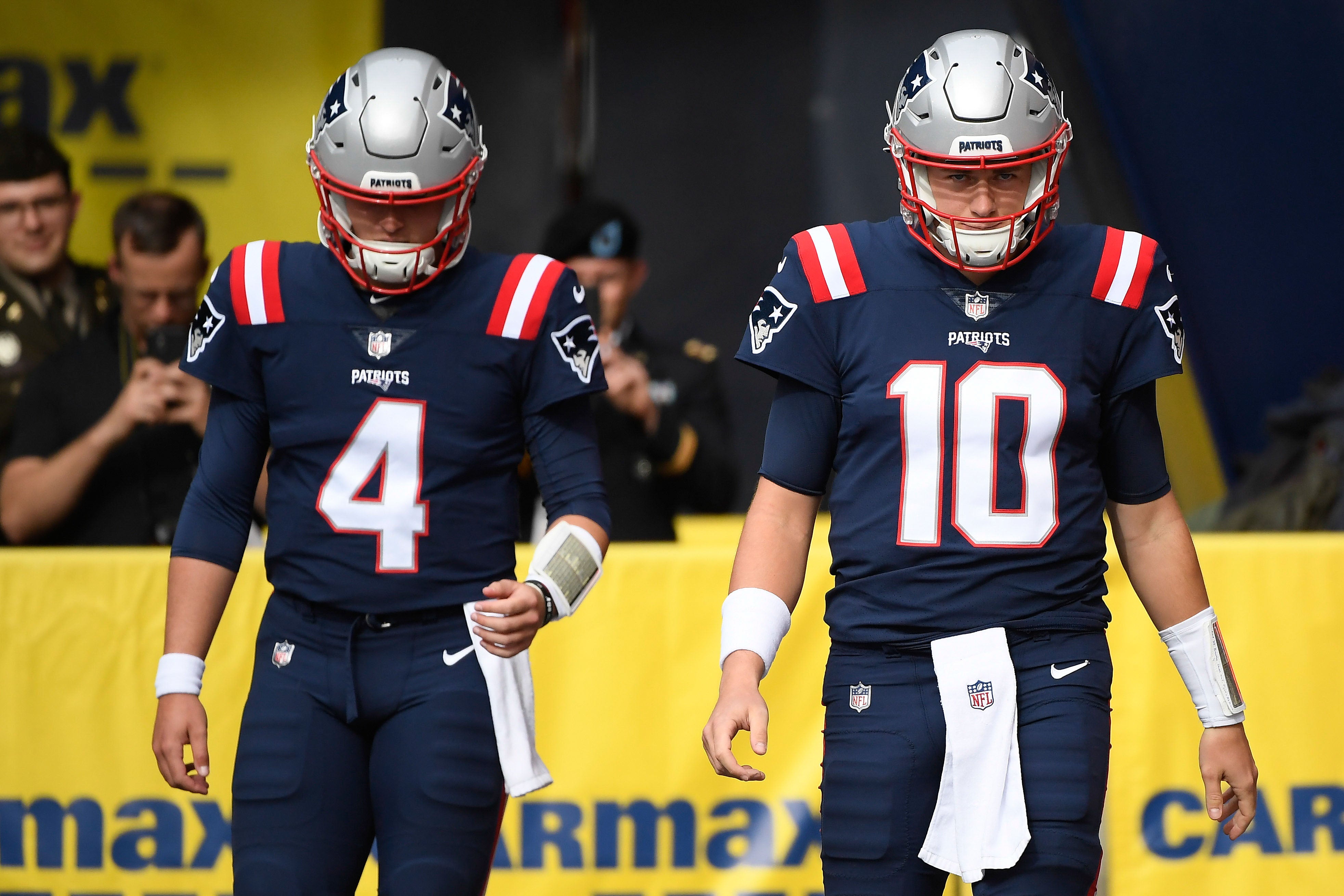 Nov 6, 2022; Foxborough, Massachusetts, USA; New England Patriots quarterback Bailey Zappe (4) and quarterback Mac Jones (10) walk onto the field prior to a game against the Indianapolis Colts at Gillette Stadium.
