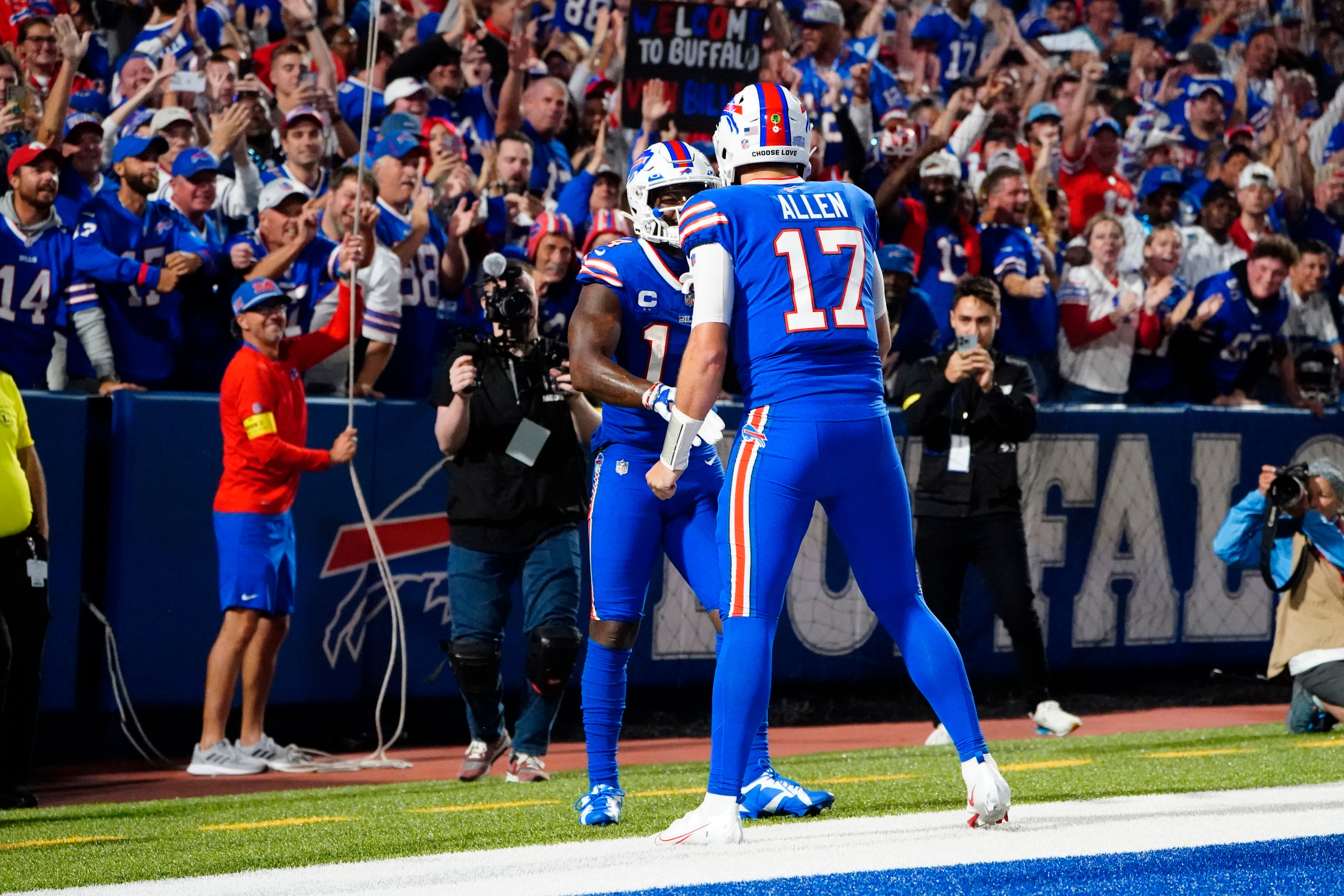 Buffalo Bills QB Josh Allen celebrating with WR Stefon Diggs
