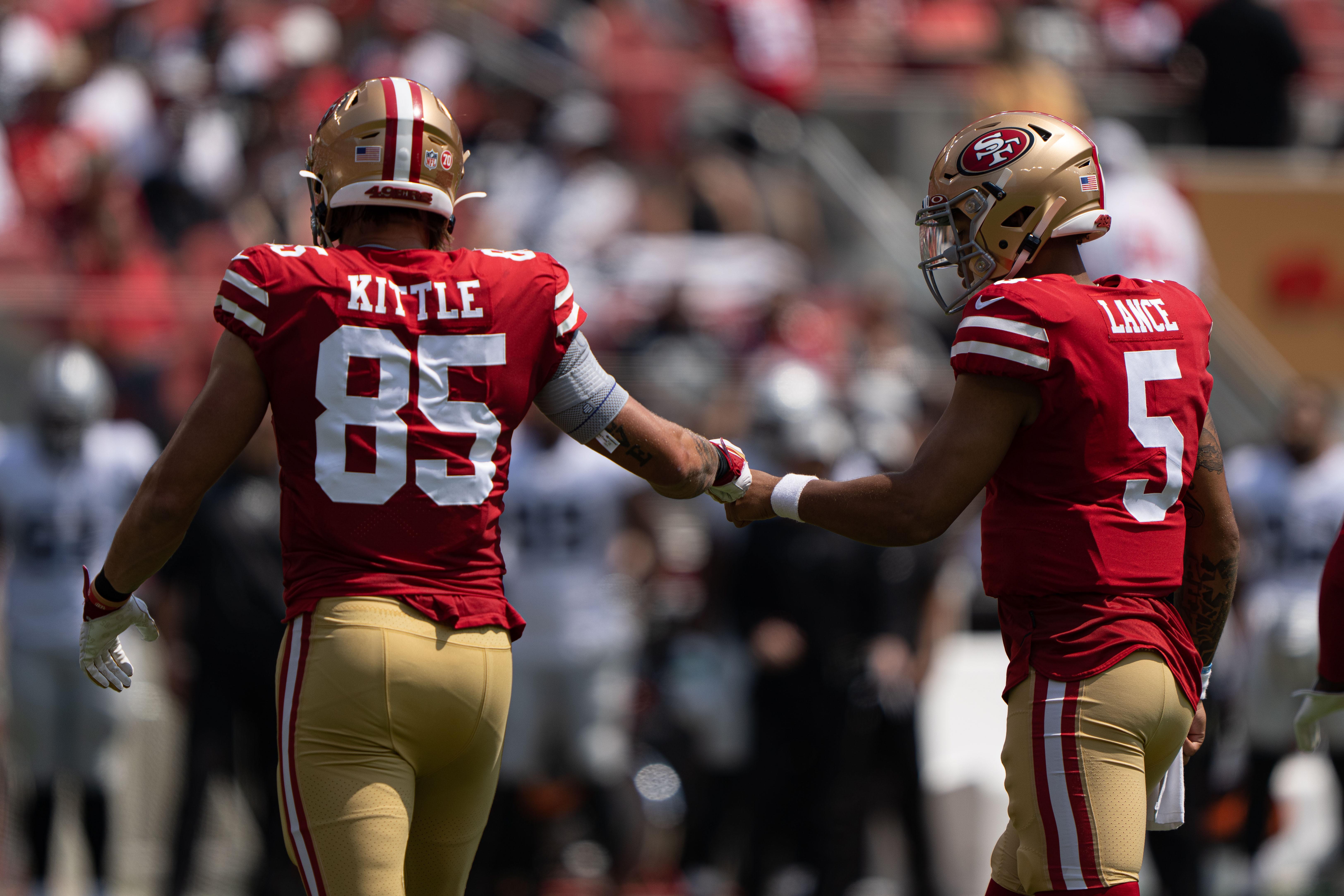 Aug 29, 2021; Santa Clara, California, USA; San Francisco 49ers tight end George Kittle (85) and quarterback Trey Lance (5) celebrate during the first quarter against the Las Vegas Raiders at Levi's Stadium.