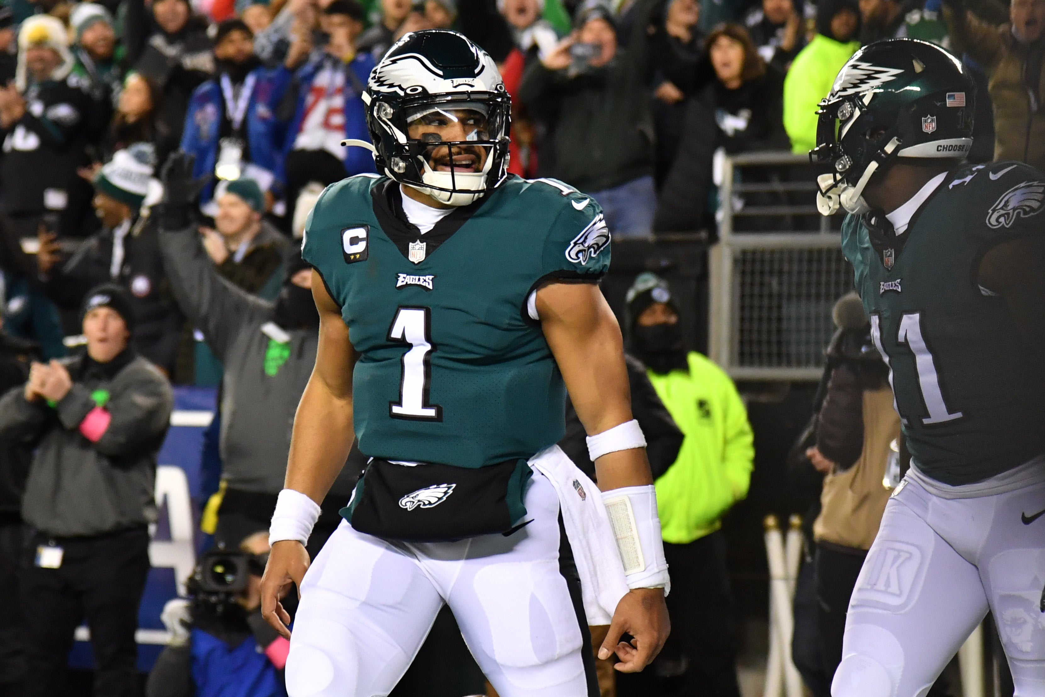 Jan 21, 2023; Philadelphia, Pennsylvania, USA; Philadelphia Eagles quarterback Jalen Hurts (1) celebrates his touchdown with wide receiver A.J. Brown (11) during the second quarter against the New York Giants during an NFC divisional round game at Lincoln Financial Field.