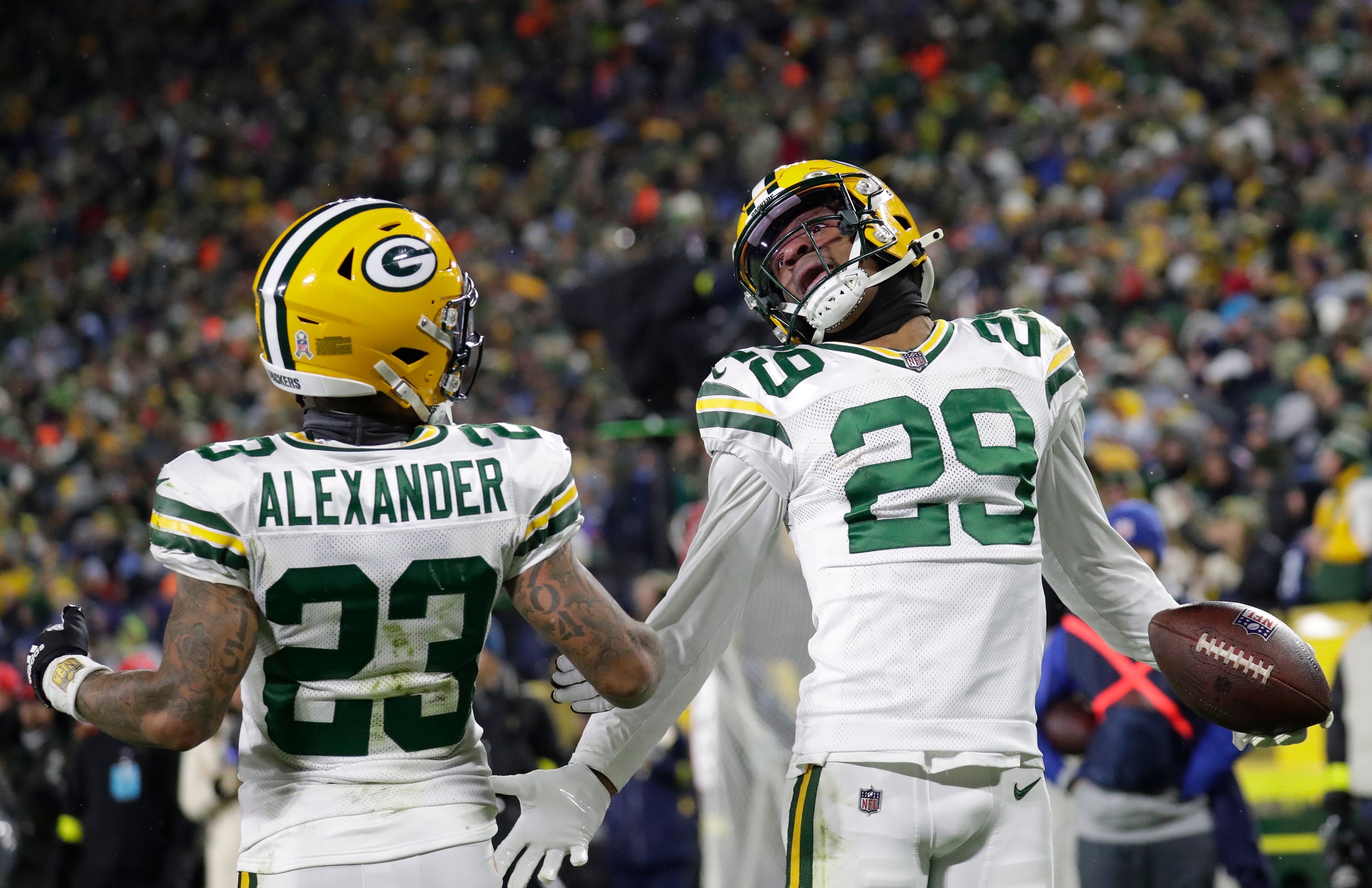 Nov 17, 2022; Green Bay, Wisconsin, USA; Green Bay Packers cornerback Rasul Douglas (29) celebrates his interception with cornerback Jaire Alexander (23) in the fourth quarter against the Tennessee Titans at Lambeau Field. Mandatory Credit: Dan Powers-USA TODAY Sports