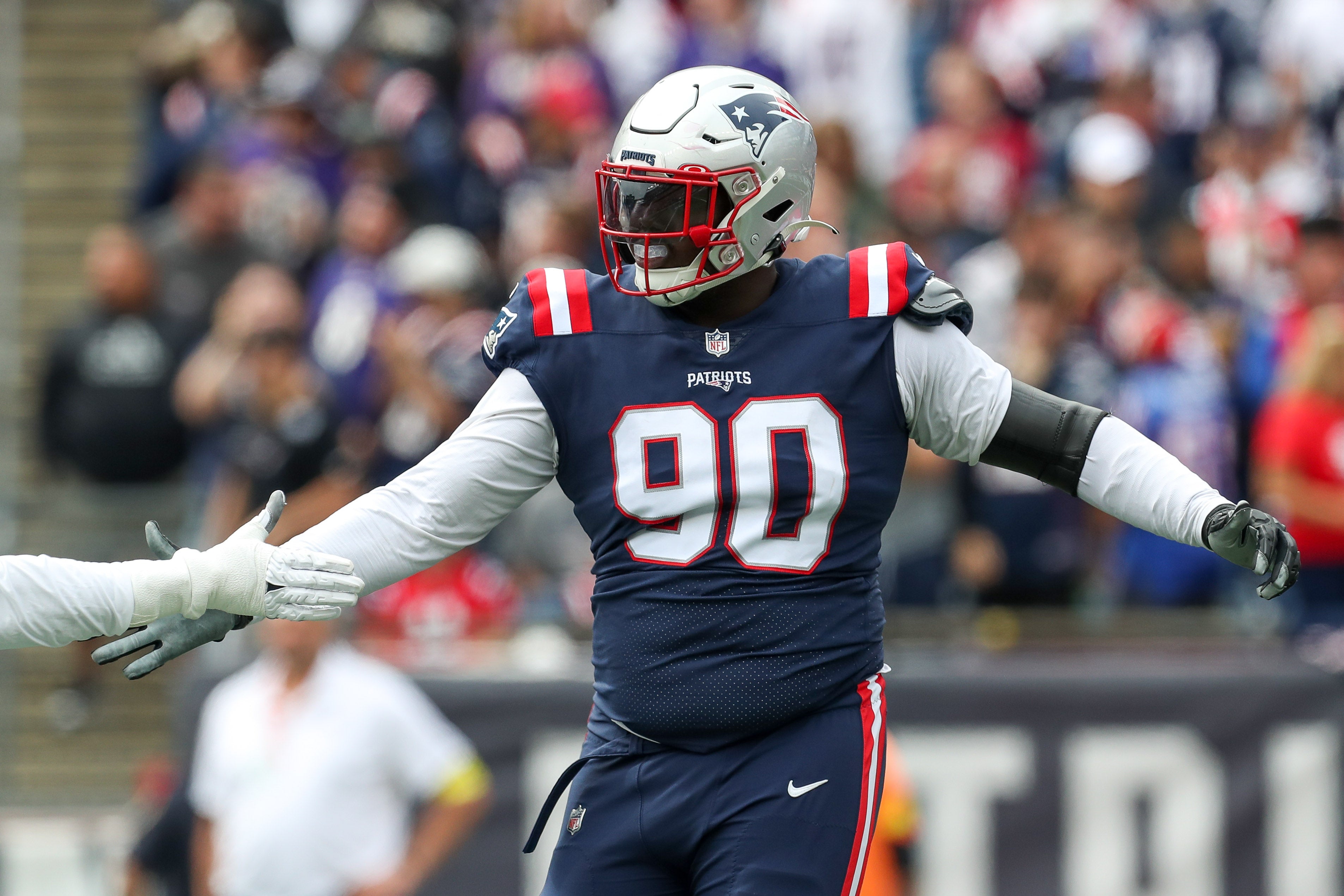 Sep 25, 2022; Foxborough, Massachusetts, USA; New England Patriots defensive tackle Christian Barmore (90) reacts during the first half against the Baltimore Ravens at Gillette Stadium.