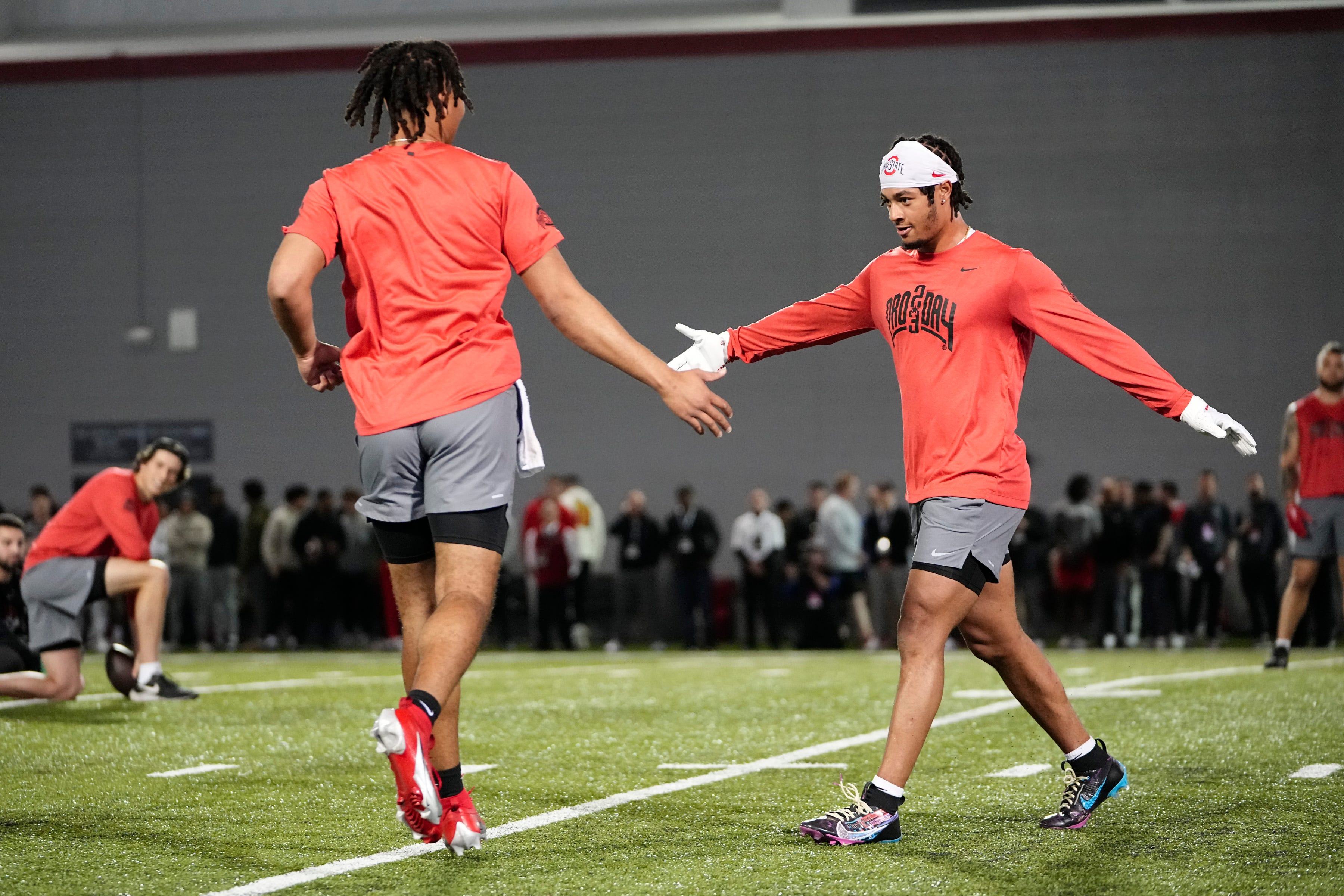 Ohio State Buckeyes quarterback C.J. Stroud high fives wide receiver Jaxon Smith-Njigba during Ohio State football s pro day at the Woody Hayes Athletic Center in Columbus on March 22, 2023. Football Ceb Osufb Pro Day.