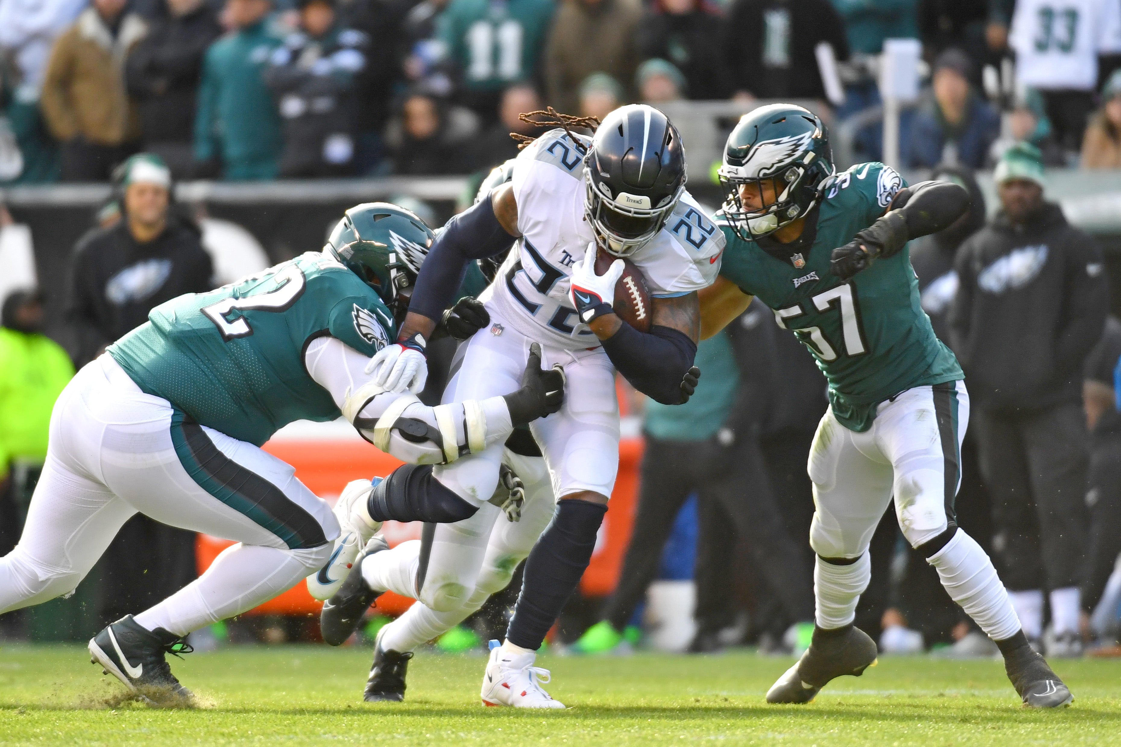 Dec 4, 2022; Philadelphia, Pennsylvania, USA; Tennessee Titans running back Derrick Henry (22) is stopped by Philadelphia Eagles defensive tackle Linval Joseph (72) and linebacker T.J. Edwards (57) during the first quarter at Lincoln Financial Field.