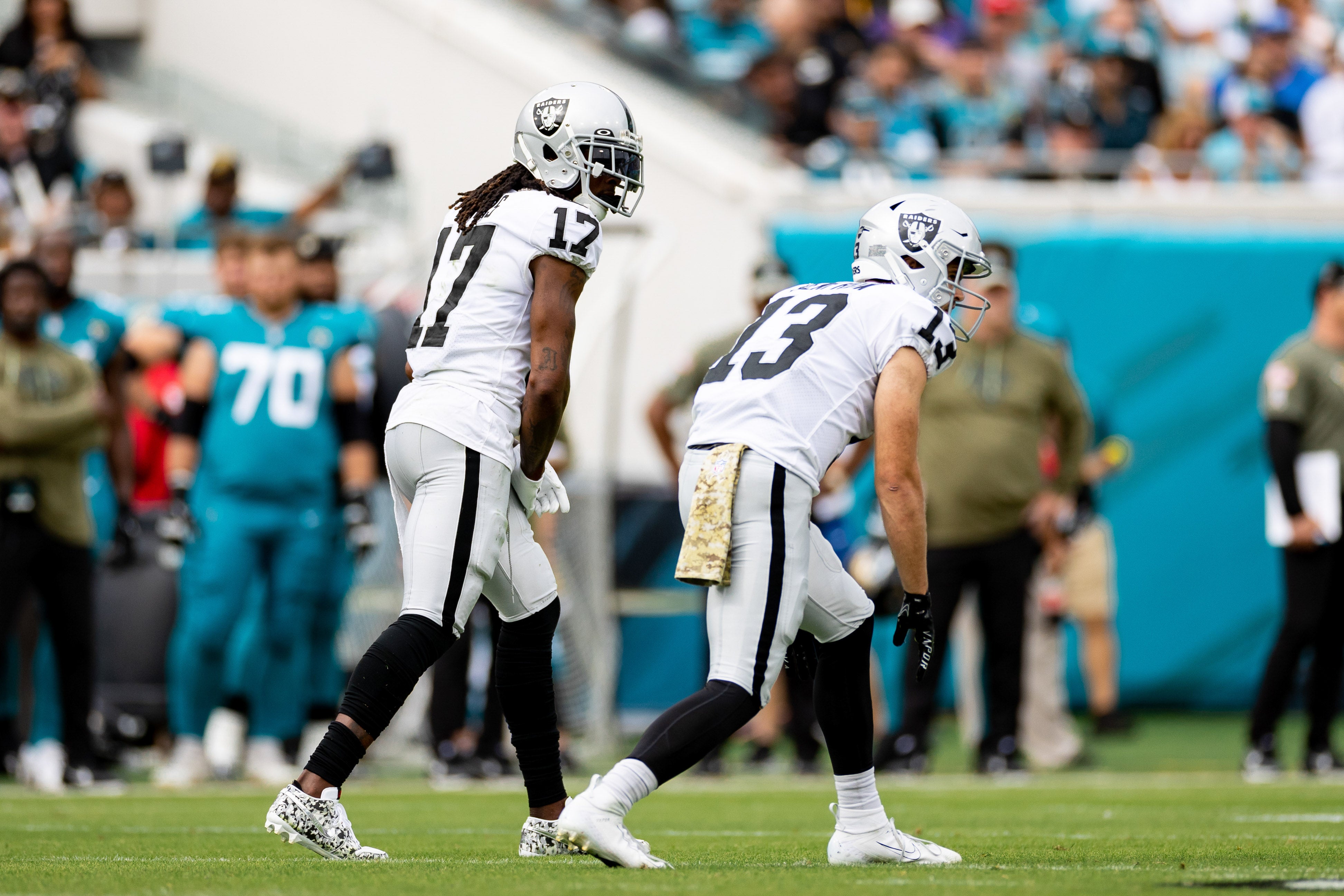 Nov 6, 2022; Jacksonville, Florida, USA; Las Vegas Raiders wide receiver Davante Adams (17) and Las Vegas Raiders wide receiver Hunter Renfrow (13) wait for the snap during the first half against the Jacksonville Jaguars at TIAA Bank Field.