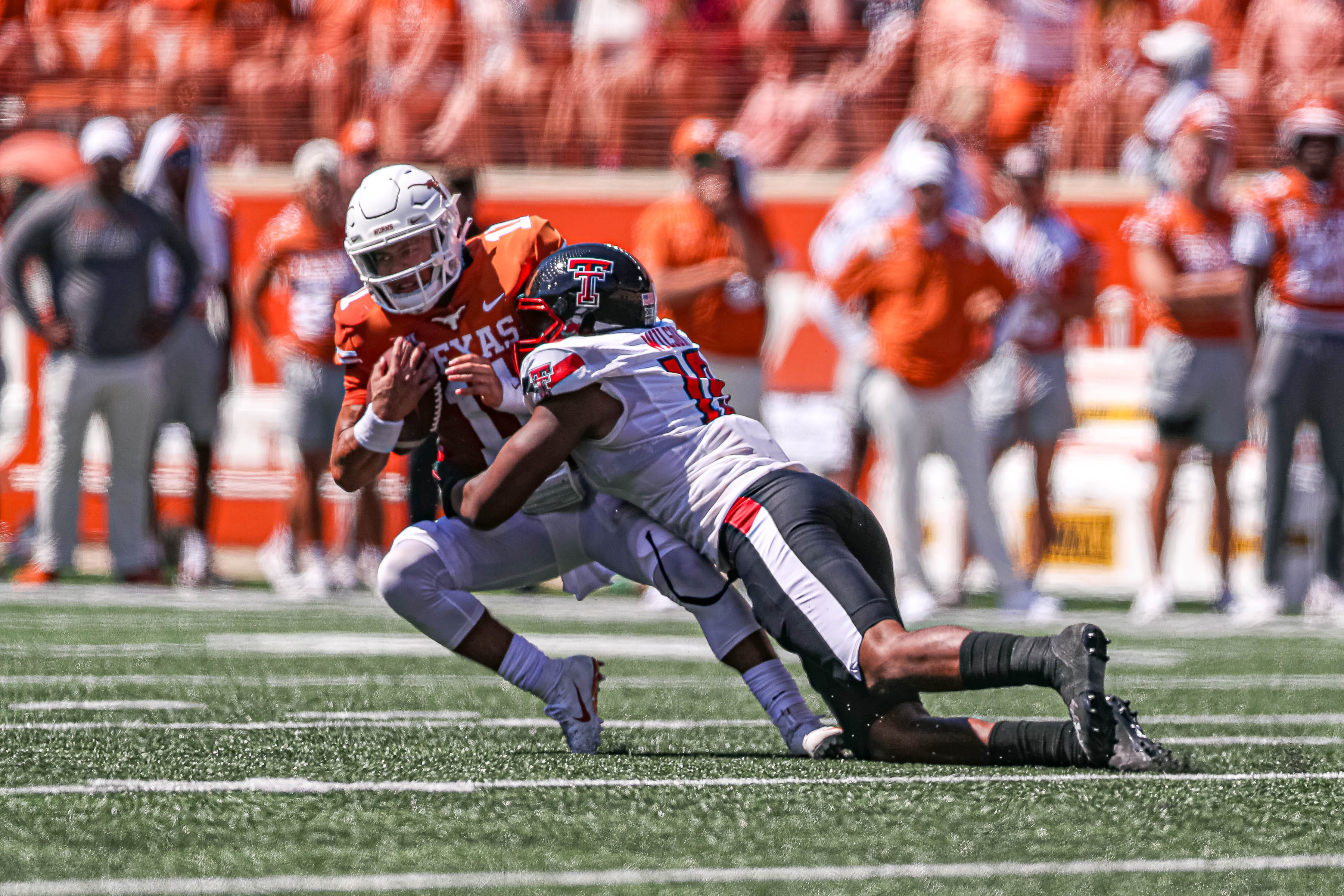 exas quarterback Casey Thompson (11) is sacked by Texas Tech defensive lineman Tyree Wilson (19). Texas Tech took on the University of Texas at Austin at Darrell K. Royal stadium in Austin, Texas on Sept. 25, 2021. Aem Texas Vs Texas Tech 23.