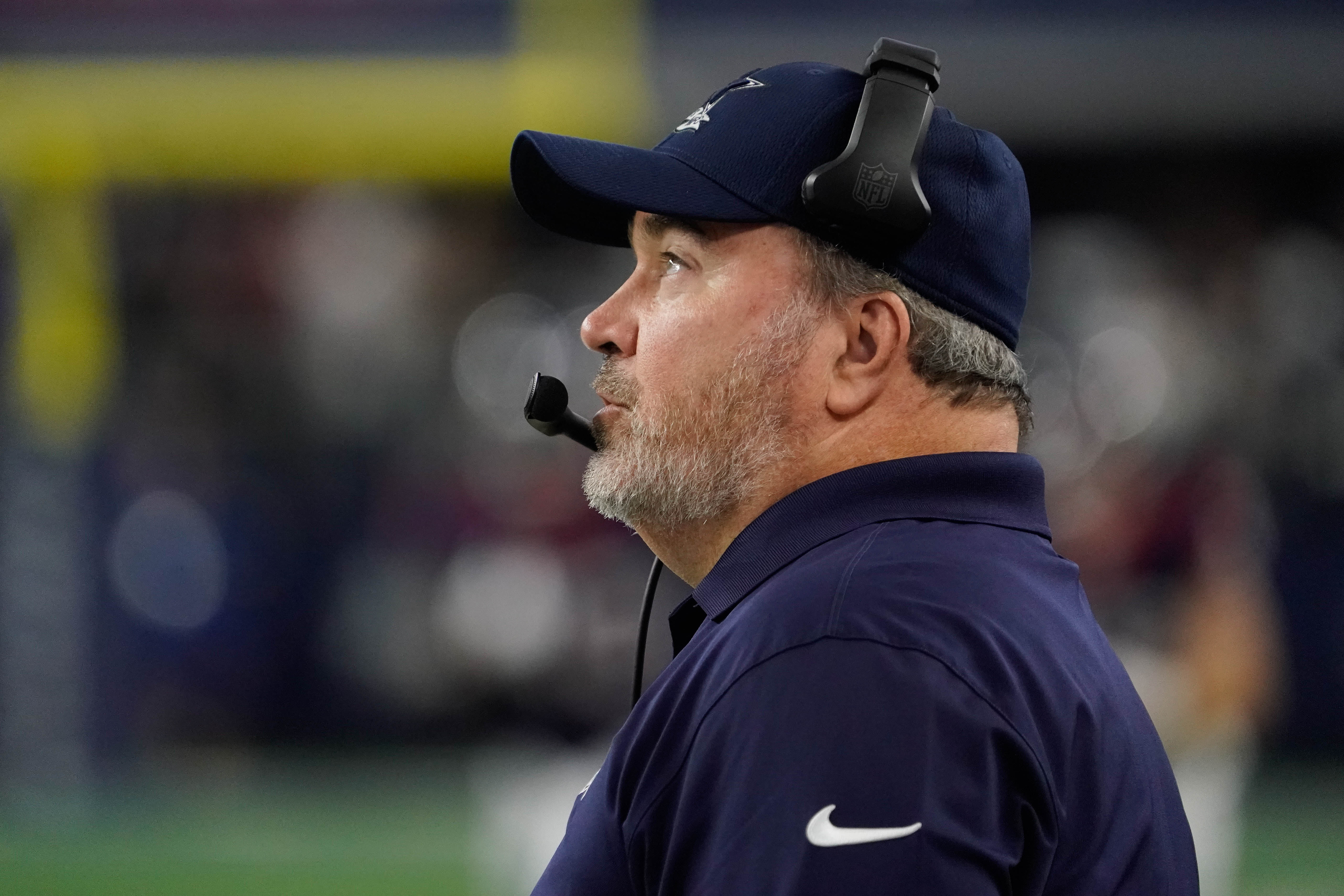 Dallas Cowboys HC Mike McCarthy looking up at the scoreboard during a game.
