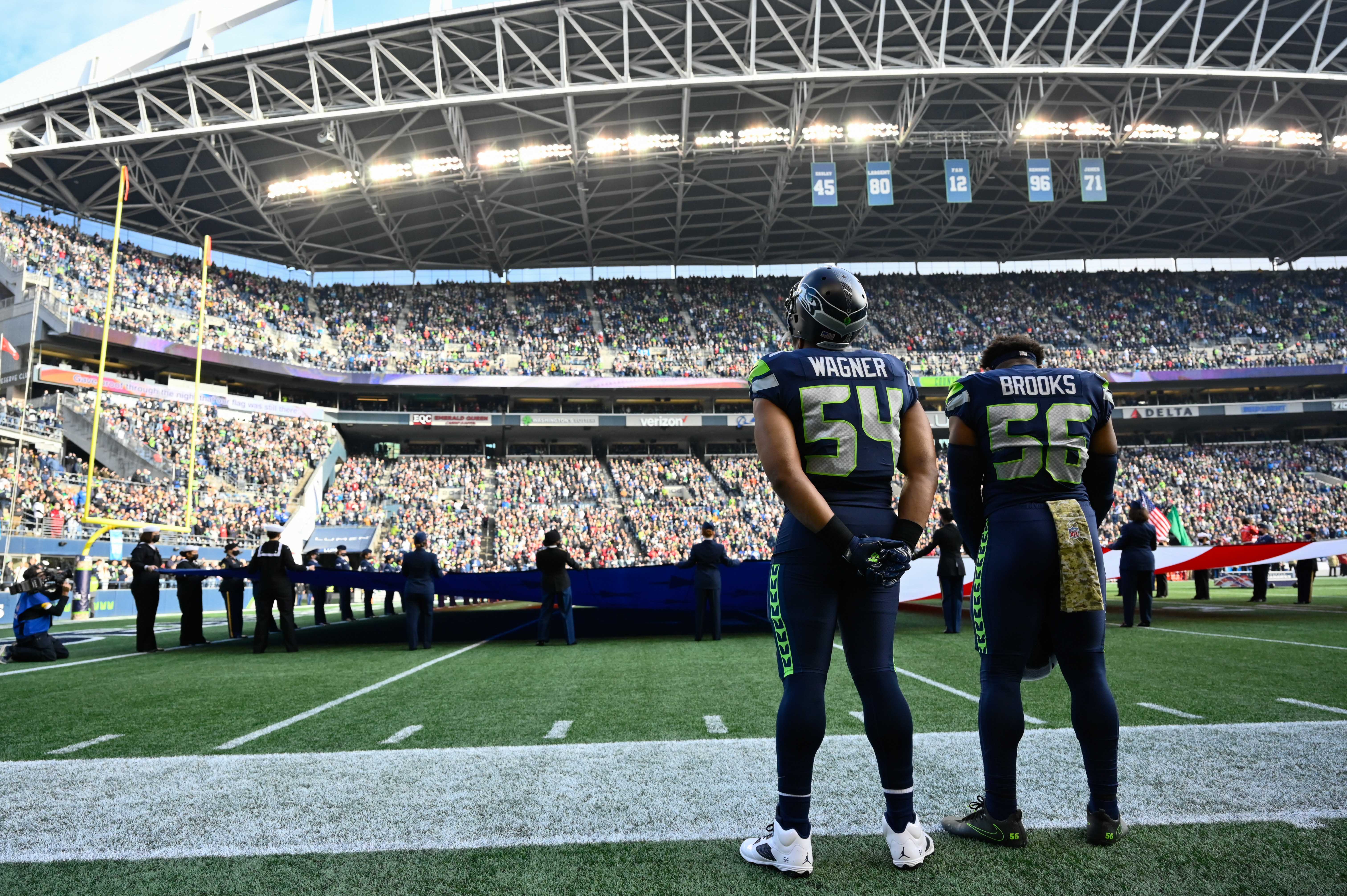 Nov 21, 2021; Seattle, Washington, USA; Seattle Seahawks middle linebacker Bobby Wagner (54) and Seattle Seahawks outside linebacker Jordyn Brooks (56) during the National Anthem prior to the game against the Arizona Cardinals. Arizona defeated Seattle 23-13.