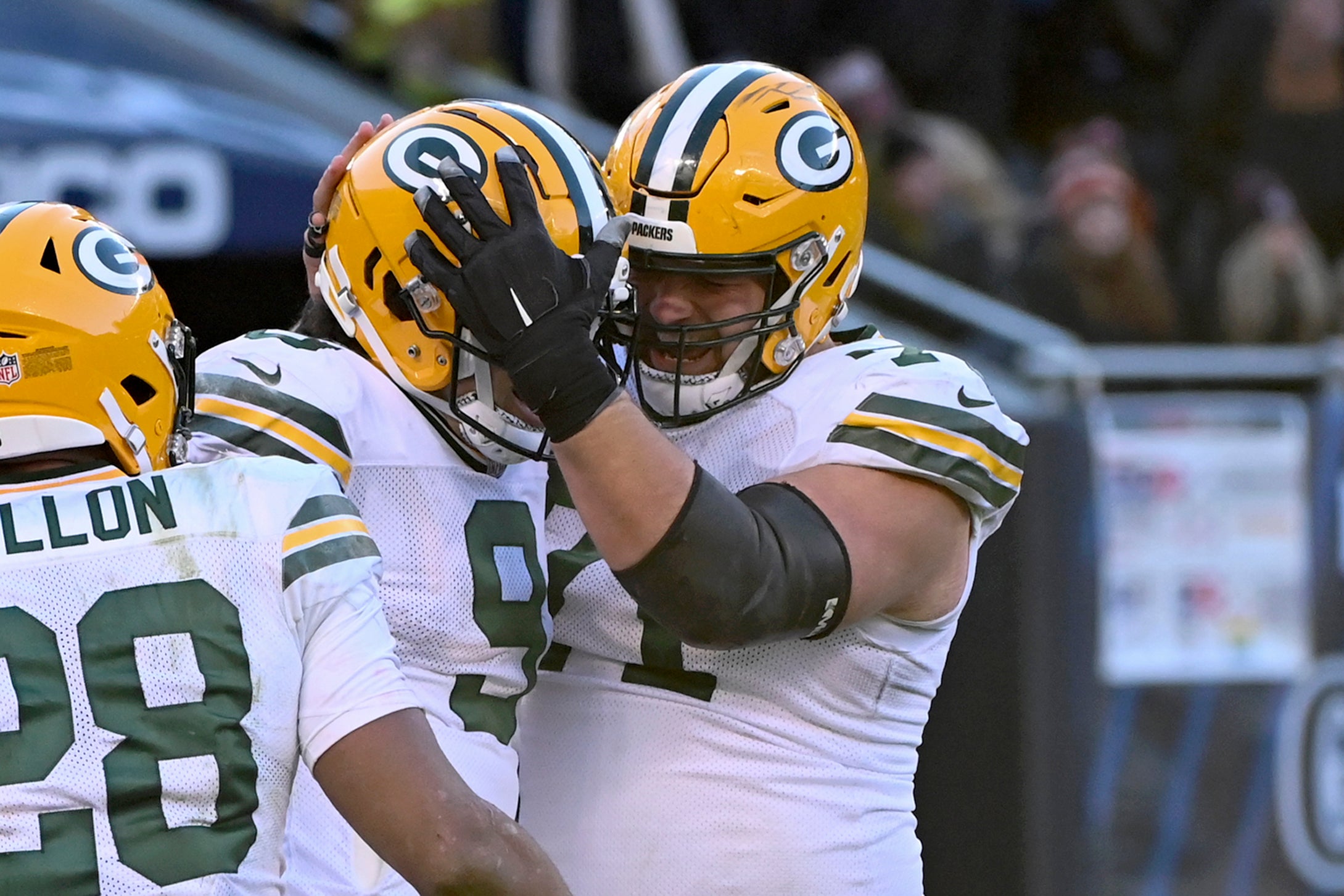 Dec 4, 2022; Chicago, Illinois, USA; Green Bay Packers wide receiver Christian Watson (9) and center Josh Myers (71) celebrate after Watson scored a touchdown against the Chicago Bears during the second half at Soldier Field.