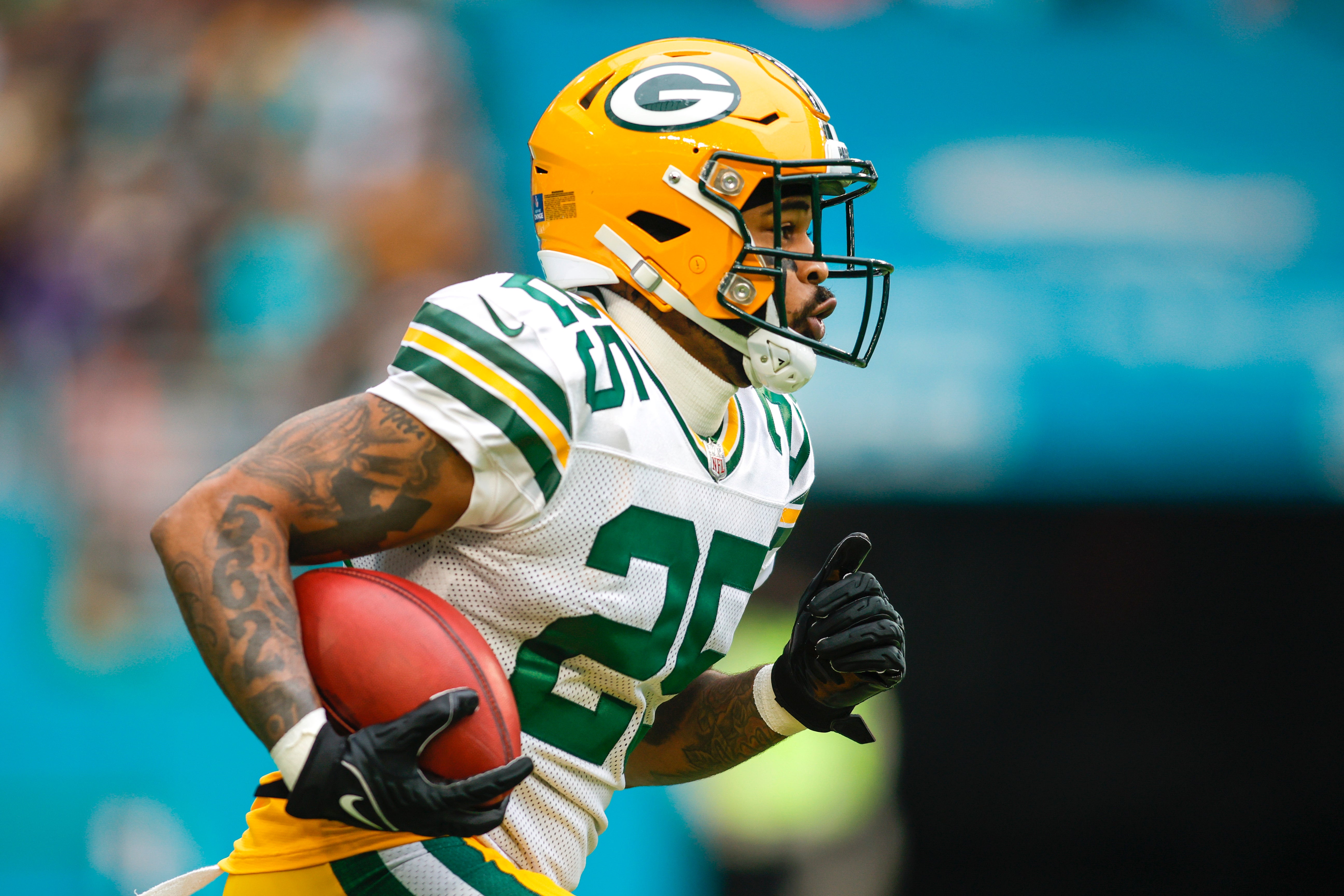 Dec 25, 2022; Miami Gardens, Florida, USA; Green Bay Packers cornerback Keisean Nixon (25) runs with the football during the first quarter against the Miami Dolphins at Hard Rock Stadium.