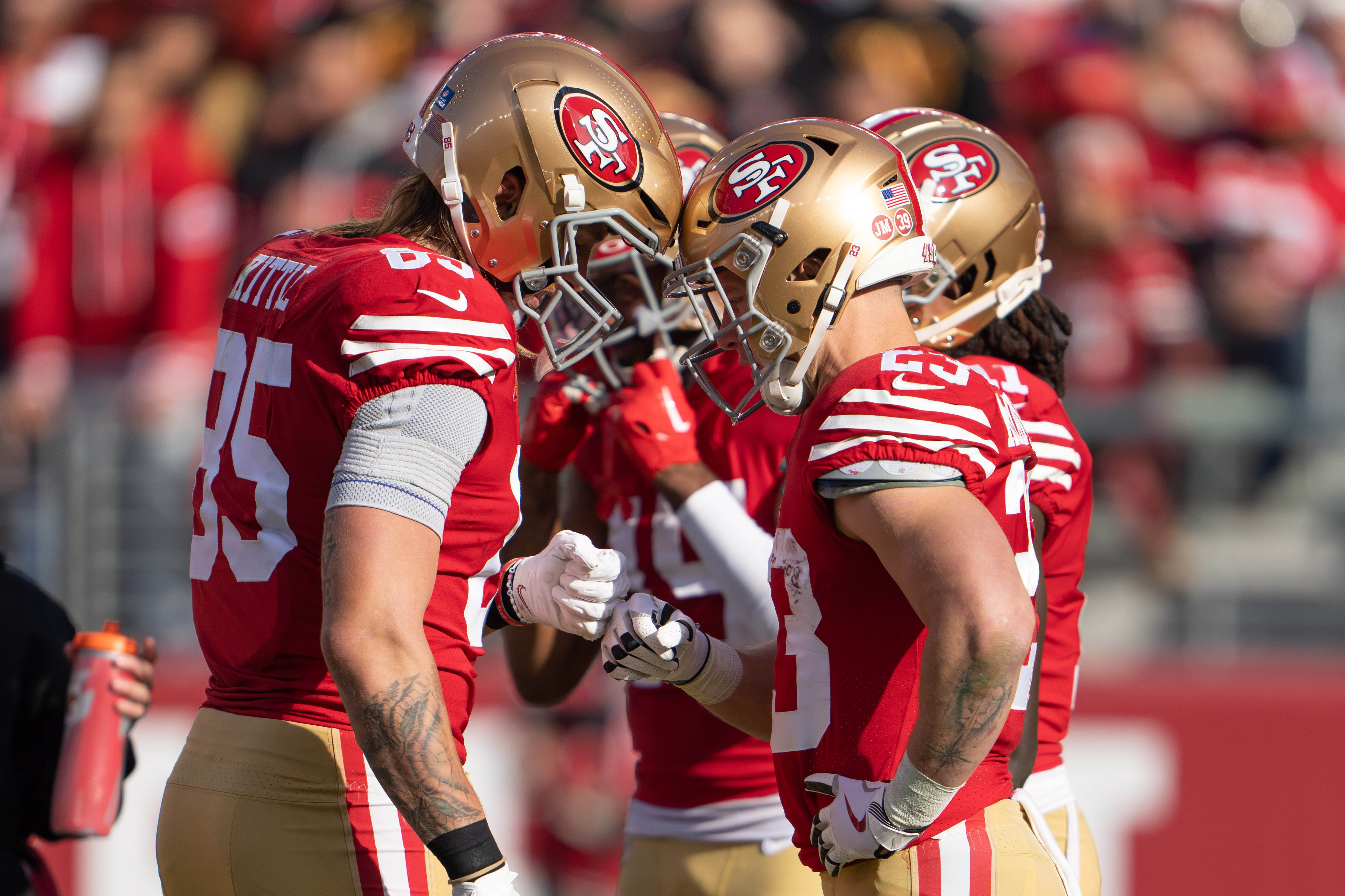 Dec 24, 2022; Santa Clara, California, USA; San Francisco 49ers tight end George Kittle (85) celebrates with running back Christian McCaffrey (23) during the second quarter against the Washington Commanders at Levi's Stadium.