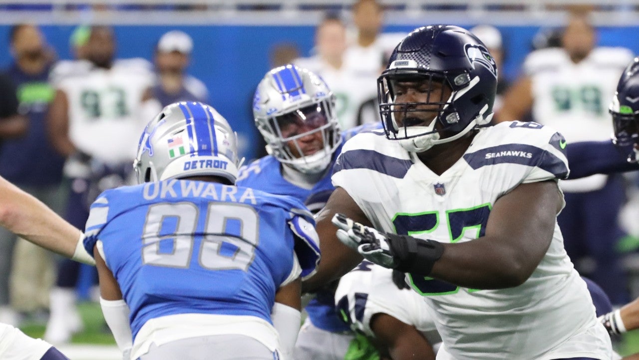 Oct 2, 2022; Detroit, Michigan, USA; Seattle Seahawks offensive tackle Charles Cross (67) blocks Detroit Lions linebacker Julian Okwara (99) during first half action at Ford Field. Mandatory Credit: Kirthmon F. Dozier-USA TODAY Sports
