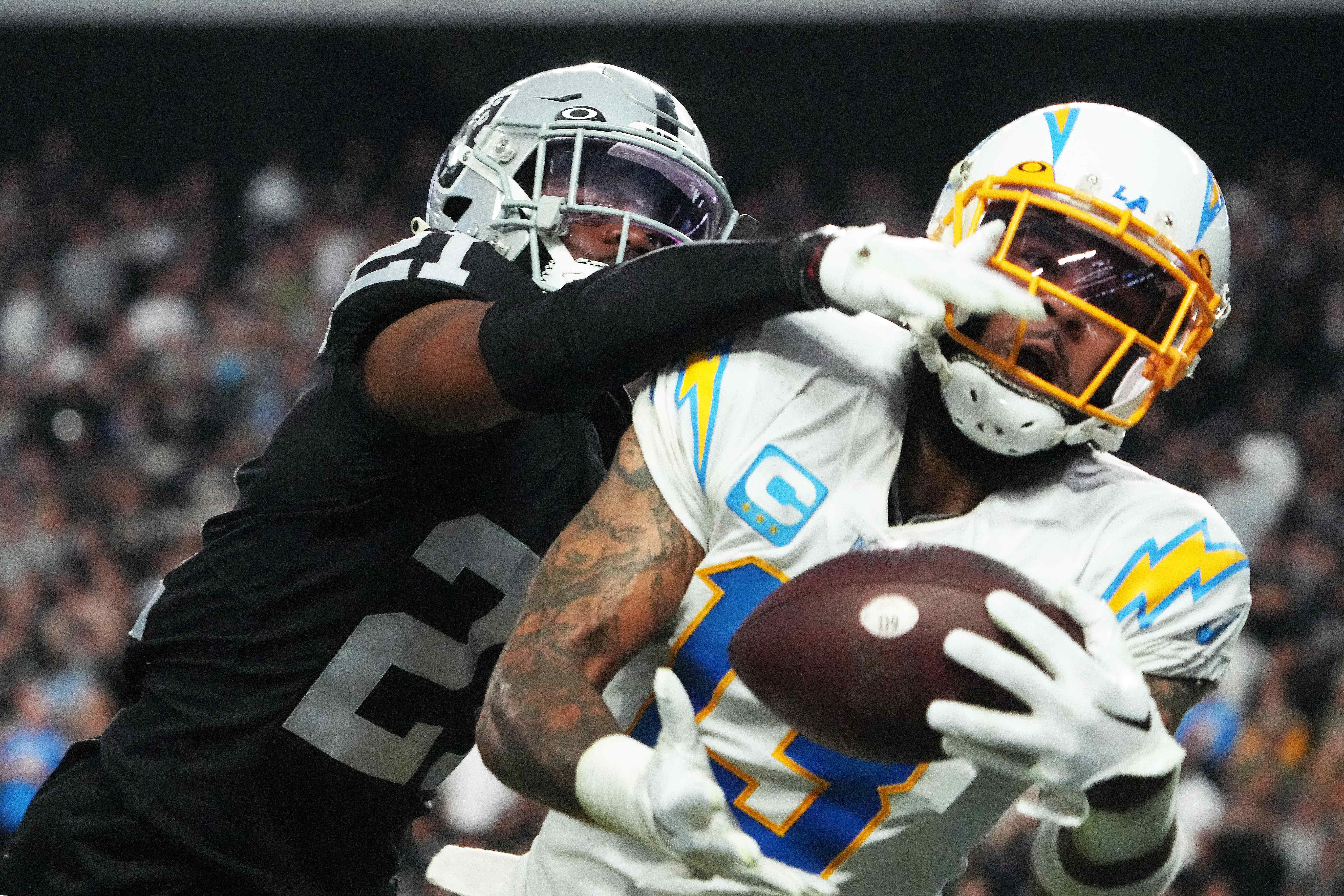 Dec 4, 2022; Paradise, Nevada, USA; Los Angeles Chargers wide receiver Keenan Allen (13) catches a 35-yard touchdown pass against Las Vegas Raiders cornerback Amik Robertson (21) in the second half at Allegiant Stadium. The Raiders defeated the Chargers 27-20.