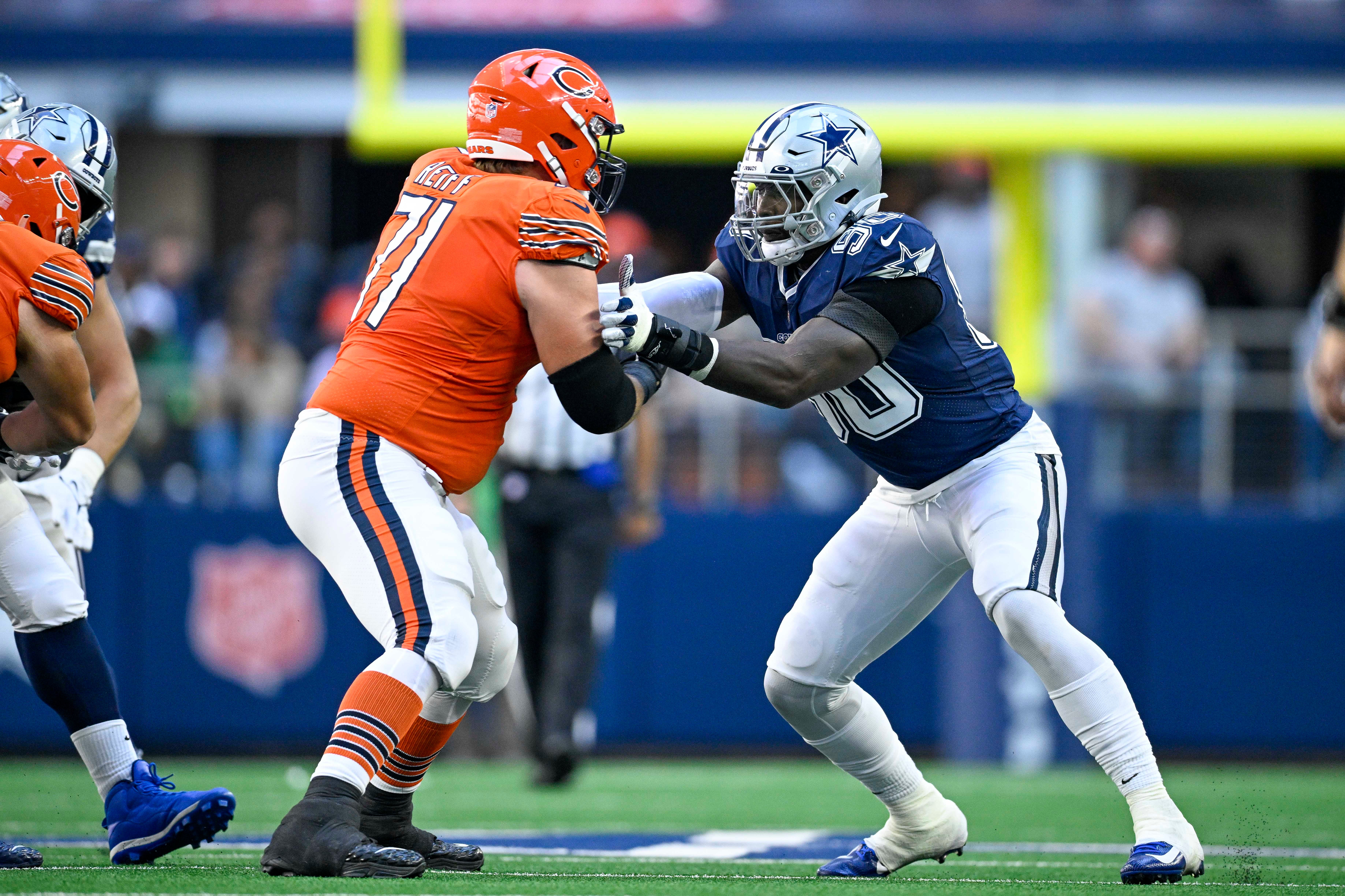 Oct 30, 2022; Arlington, Texas, USA; Chicago Bears offensive tackle Riley Reiff (71) and Dallas Cowboys defensive end DeMarcus Lawrence (90) in action during the game between the Dallas Cowboys and the Chicago Bears at AT&T Stadium.
