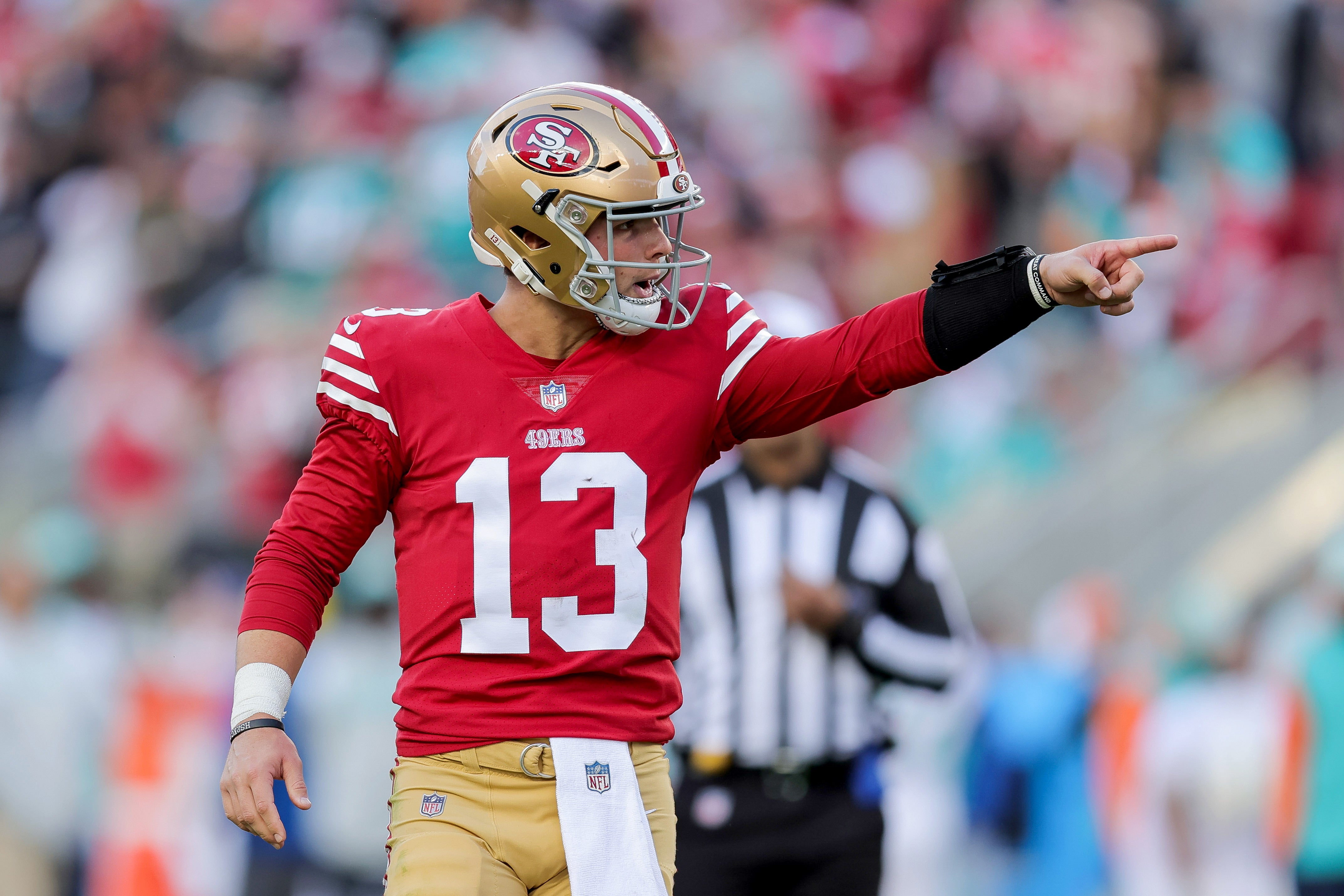 Dec 4, 2022; Santa Clara, California, USA; San Francisco 49ers quarterback Brock Purdy (13) celebrates after throwing a touchdown pass during the second quarter against the Miami Dolphins at Levi's Stadium.