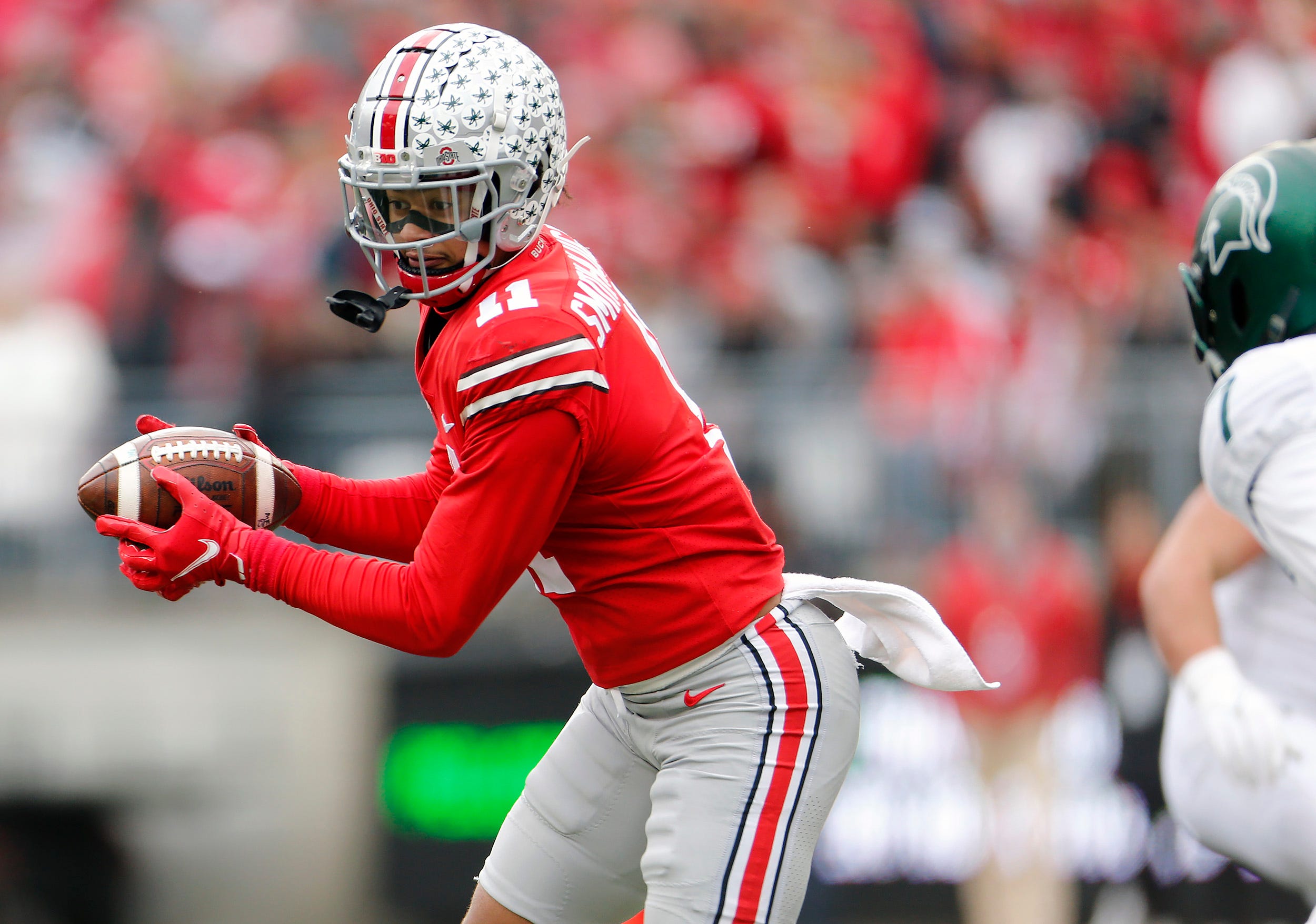 Ohio State Buckeyes wide receiver Jaxon Smith-Njigba (11) comes up with the catch against Michigan State Spartans during the third quarter of their NCAA College football game at Ohio Stadium in Columbus, Ohio on November 20, 2021. Osu21msu Kwr 42.