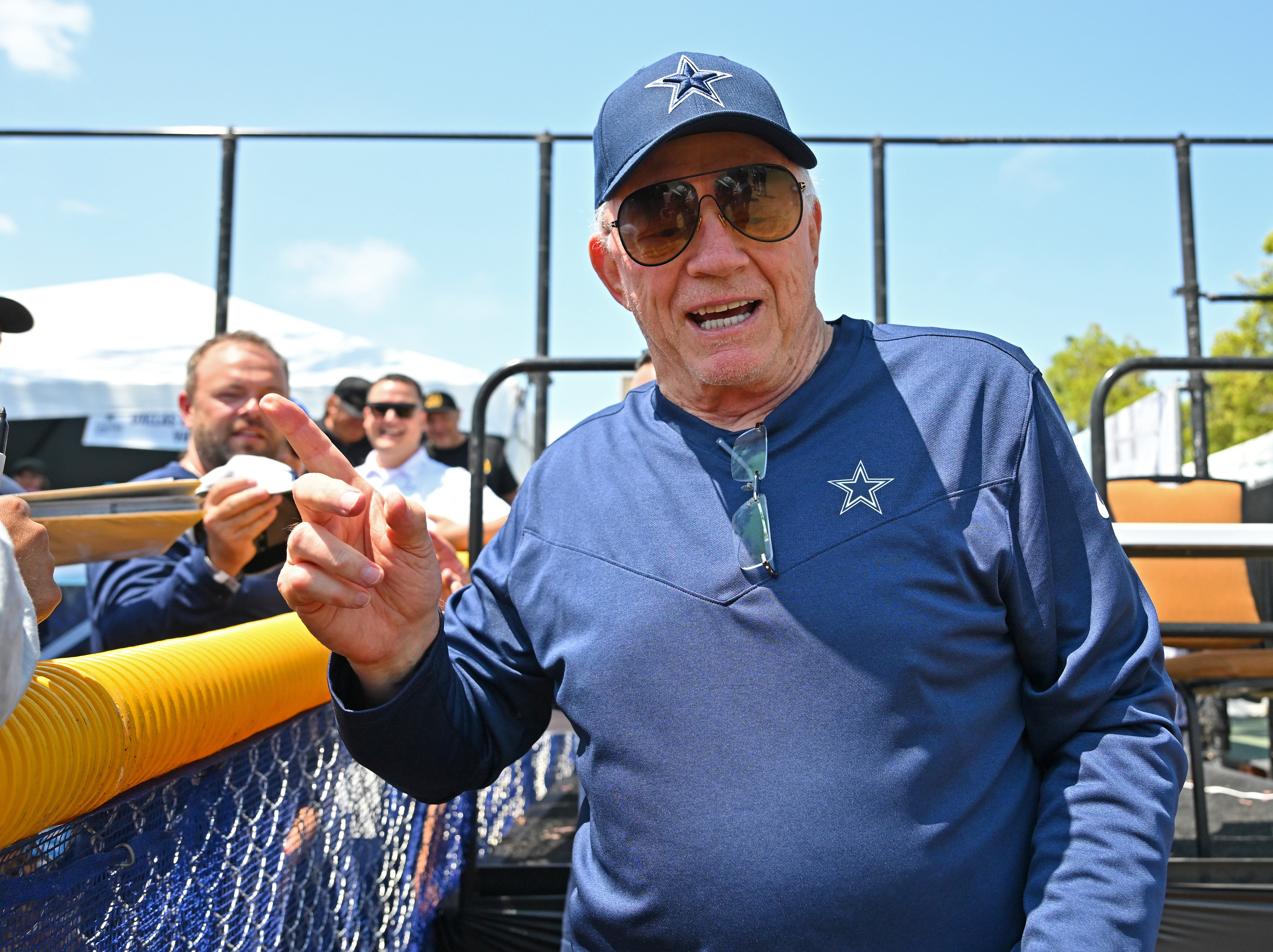 Dallas Cowboys owner Jerry Jones greeting fans at training camp.