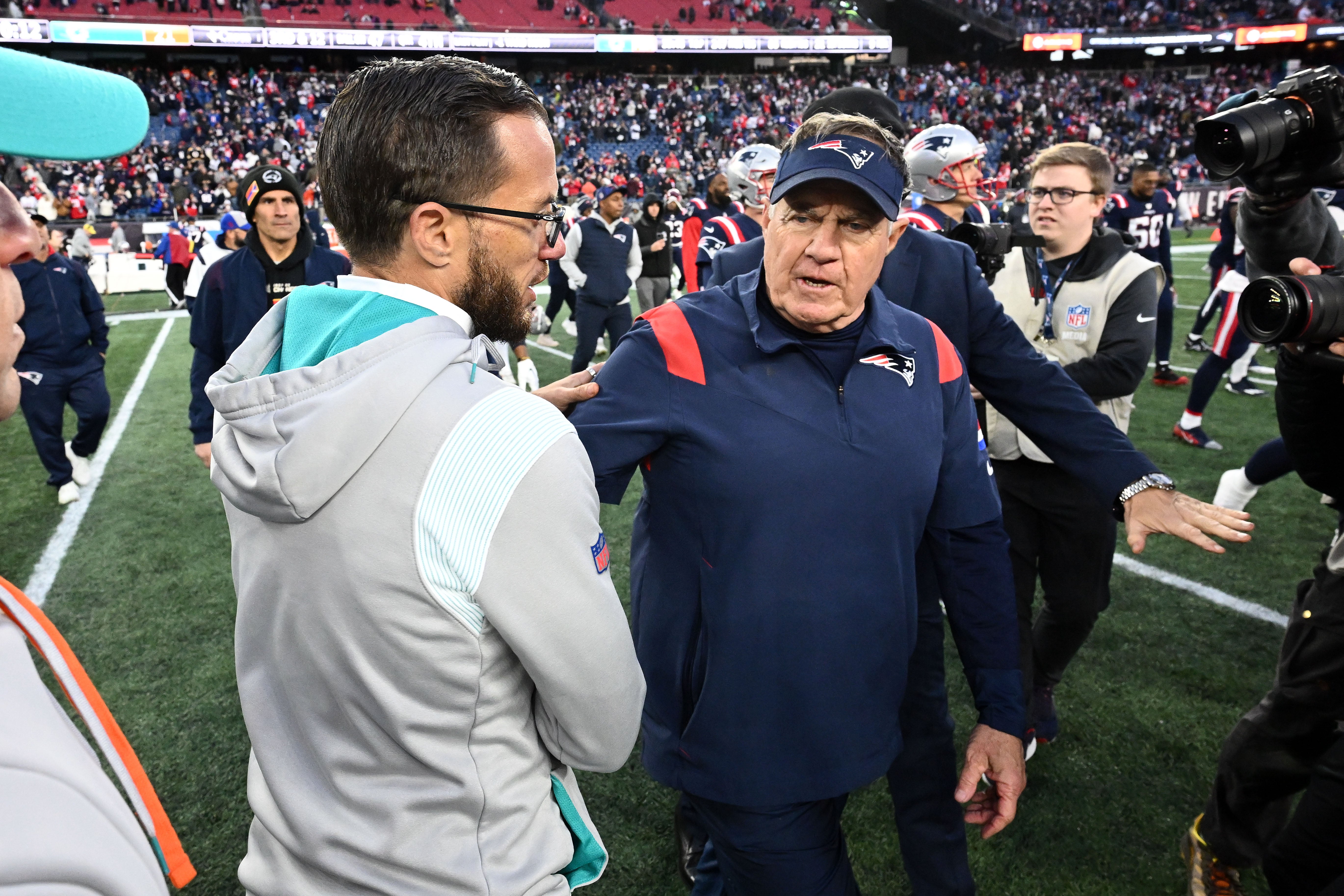 Jan 1, 2023; Foxborough, Massachusetts, USA; New England Patriots head coach Bill Belichick shakes hands with Miami Dolphins head coach Mike McDaniel after a game at Gillette Stadium.
