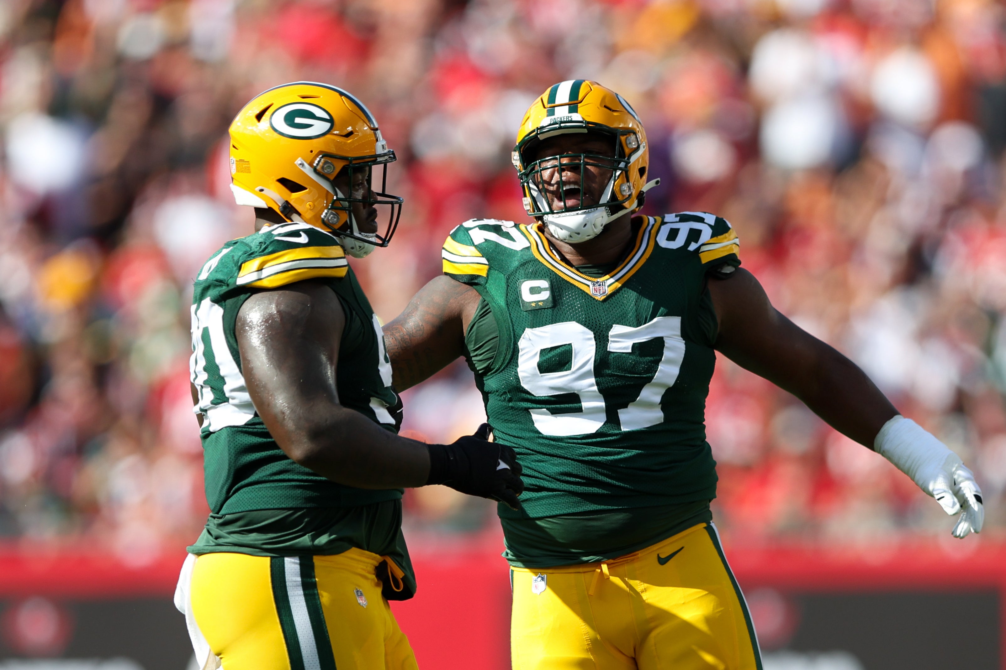 Sep 25, 2022; Tampa, Florida, USA; Green Bay Packers defensive tackle Kenny Clark (97) reads after sac=king Tampa Bay Buccaneers quarterback Tom Brady (12) (not pictured) in the first quarter at Raymond James Stadium.