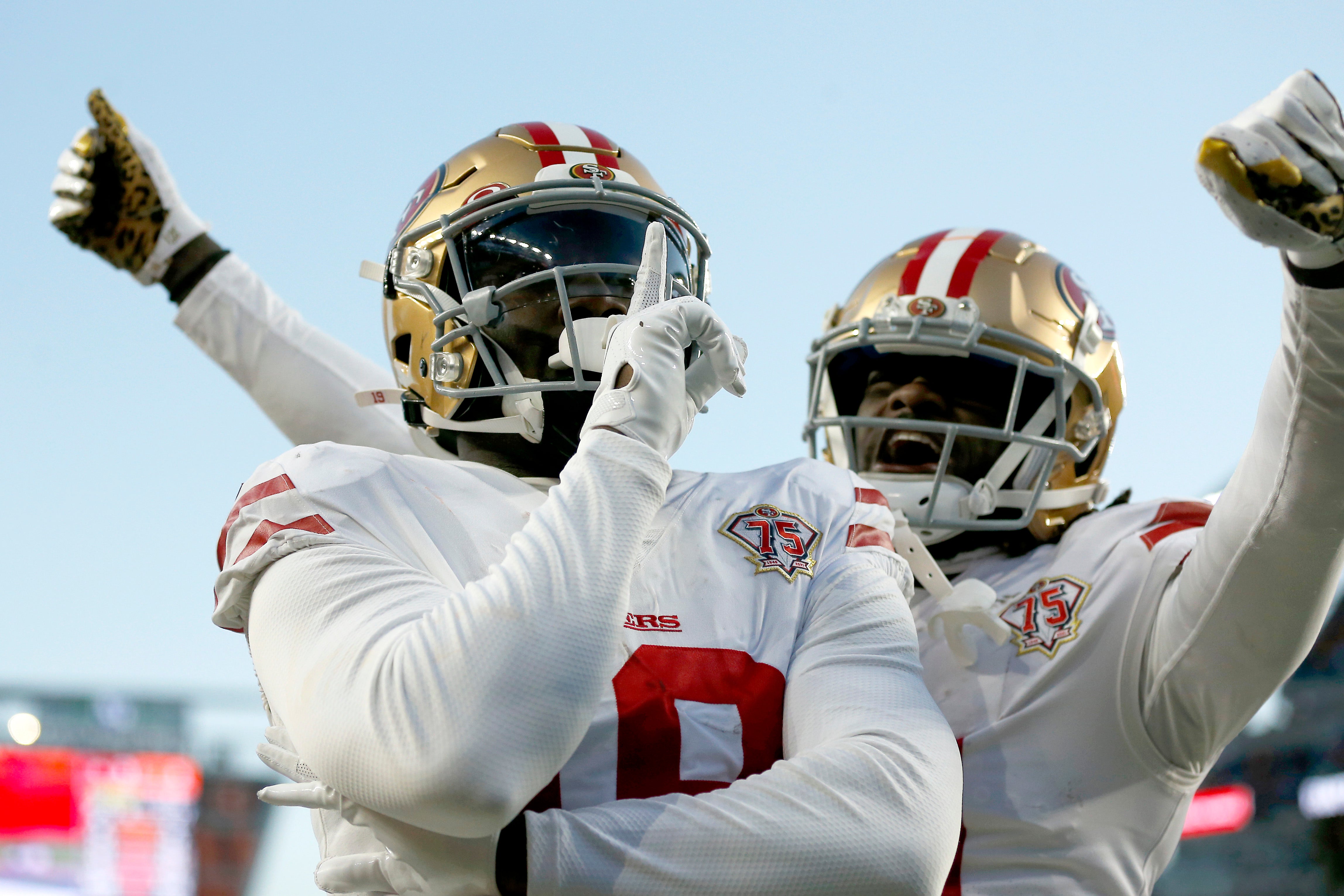 Dec 12, 2021; Cincinnati, Ohio, USA; San Francisco 49ers wide receiver Deebo Samuel (left) celebrates his touchdown with wide receiver Brandon Aiyuk (11) during the second quarter against the Cincinnati Bengals at Paul Brown Stadium.