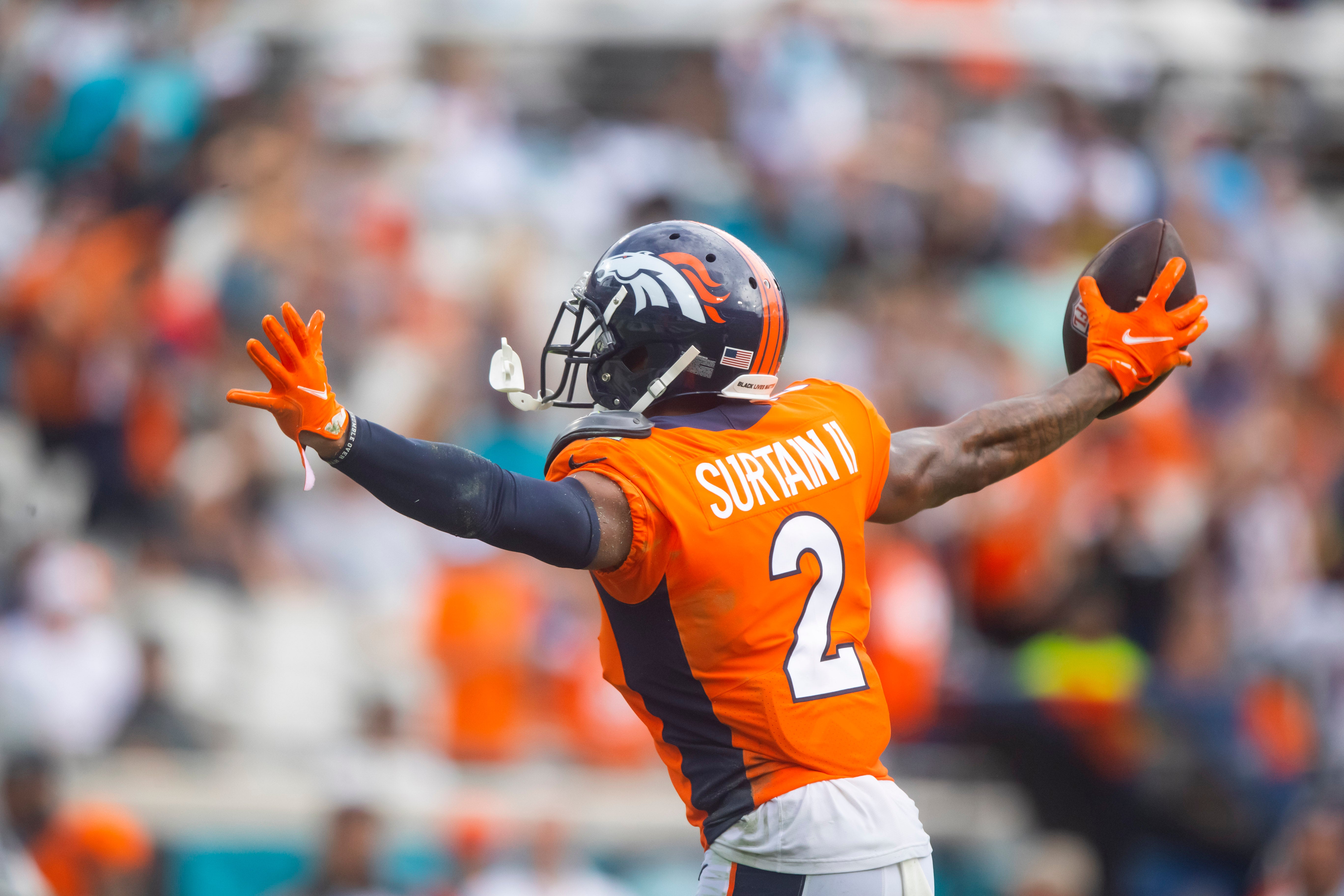Sep 25, 2022; Denver, Colorado, USA; Denver Broncos cornerback Pat Surtain II (2) celebrates with linebacker Bradley Chubb (55) after a play in the first quarter against the San Francisco 49ers at Empower Field at Mile High.