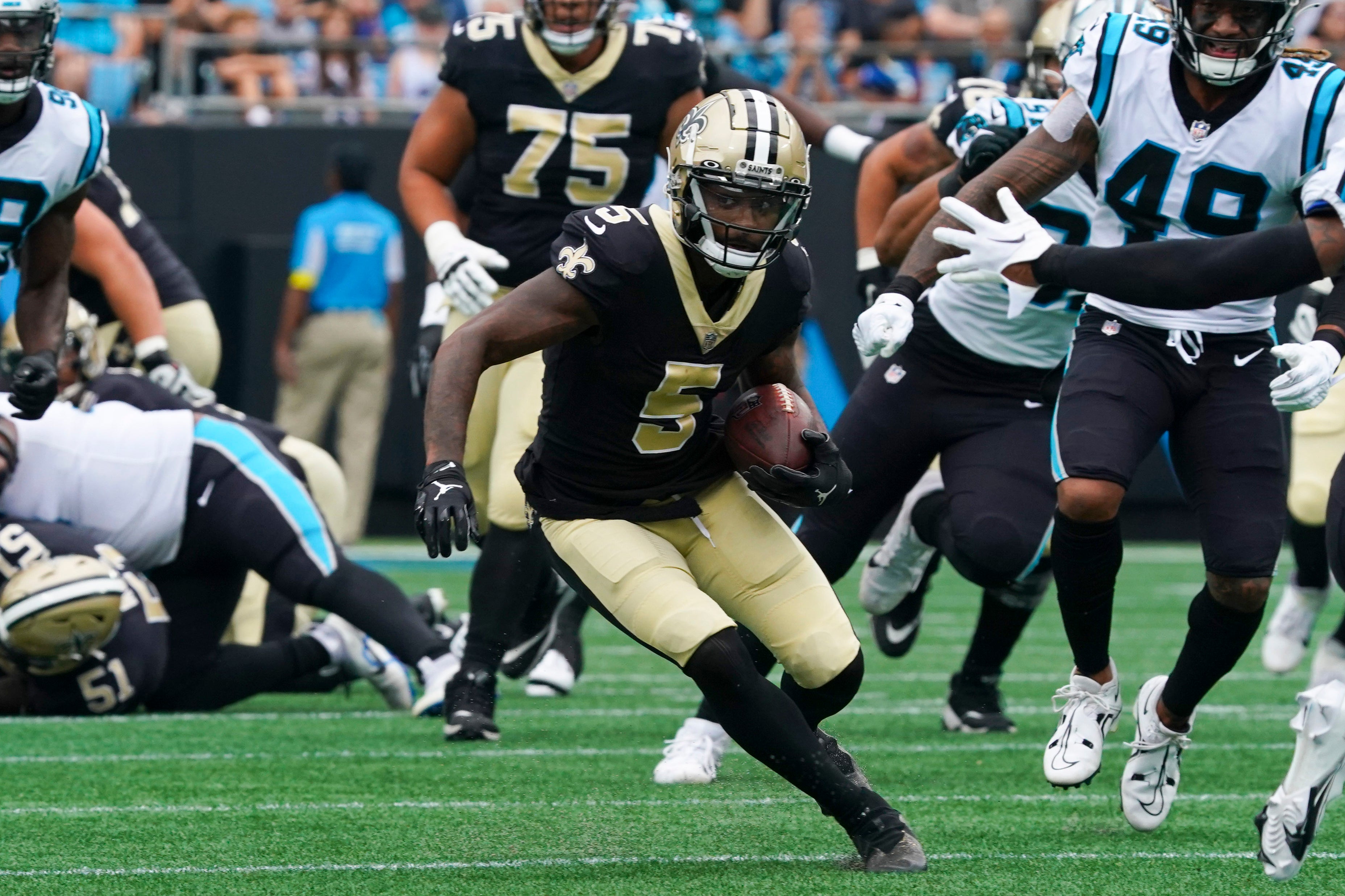 Sep 25, 2022; Charlotte, North Carolina, USA; New Orleans Saints wide receiver Jarvis Landry (5) runs with the ball against the Carolina Panthers during the first quarter at Bank of America Stadium.